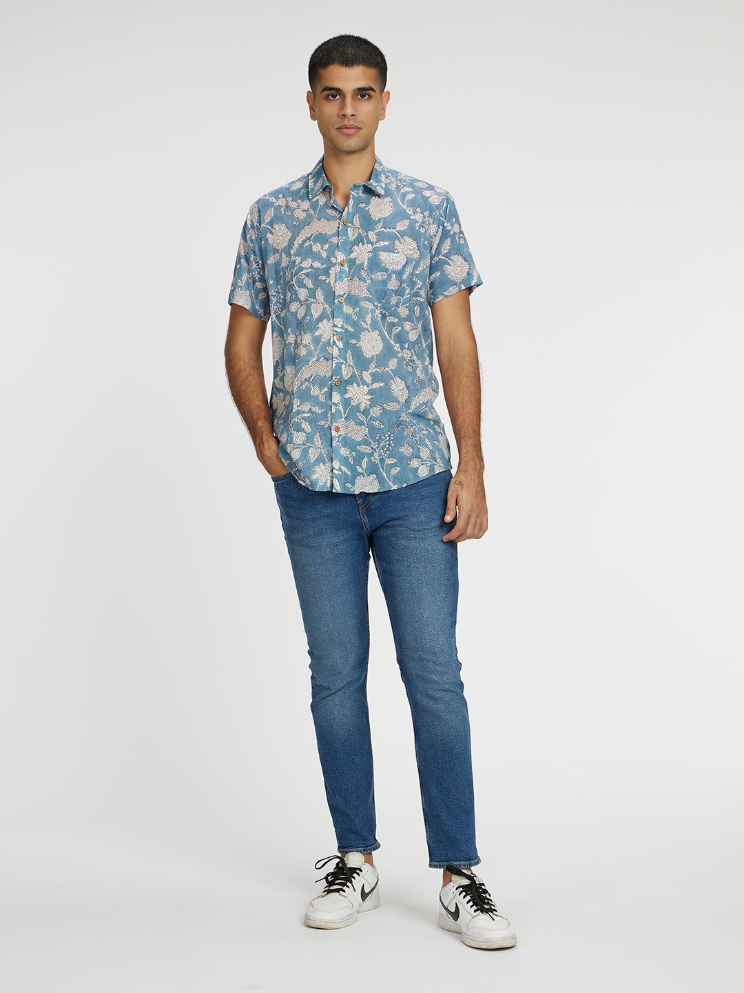 Brown Model wearing Blue Floral Block Printed Holiday Halfsleeves Mulmul Cotton Shirt by Brand Patrah