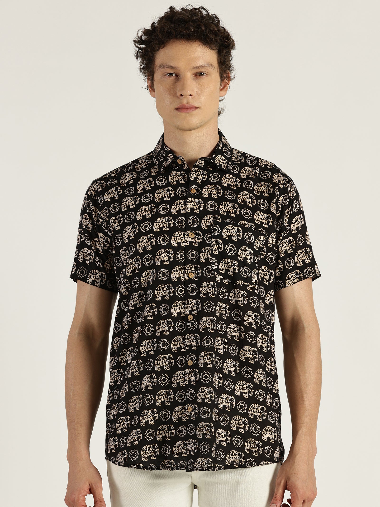 White Model wearing Black Ethnic Elephant Printed Halfsleeves Cotton Shirt by Brand Patrah