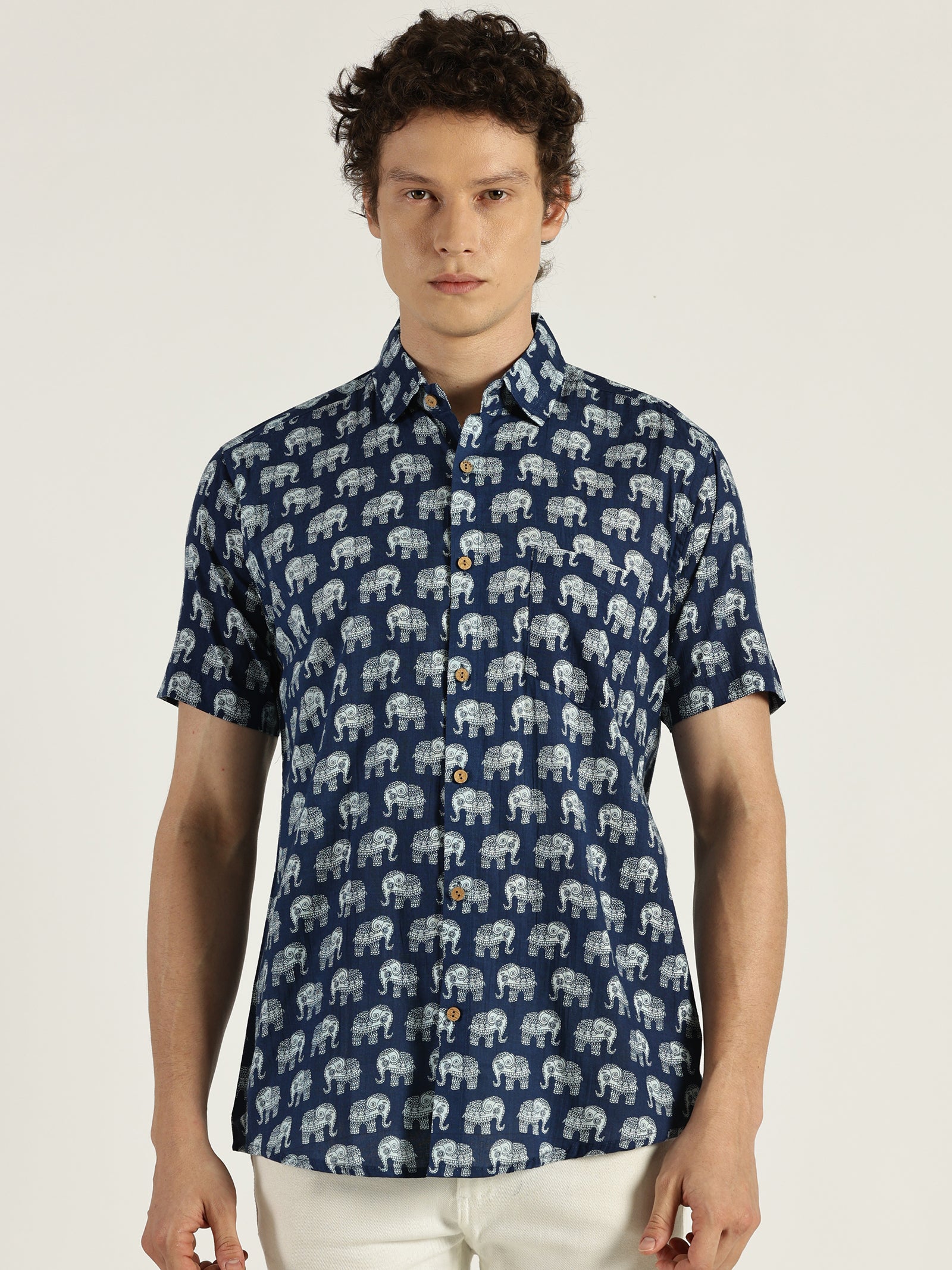 White Model wearing Indigo Ethnic Elephant Printed Halfsleeves Cotton Shirt by Brand Patrah