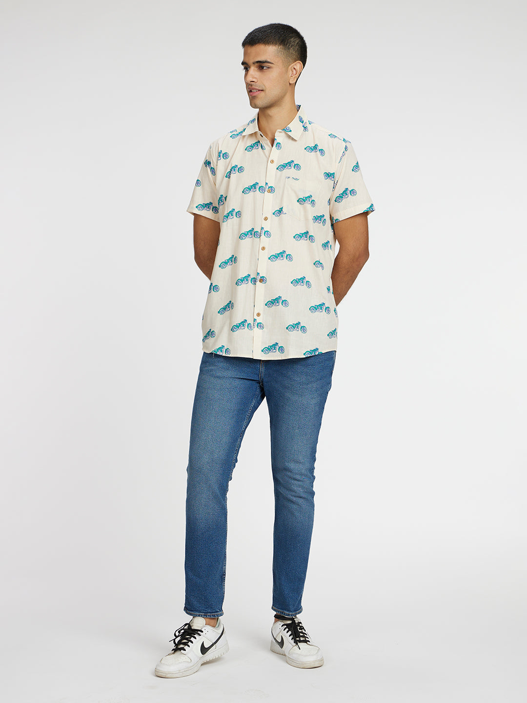 Model Facing sideways wearing Blue Bike Printed Halfsleeves Cotton Shirt by Brand Patrah