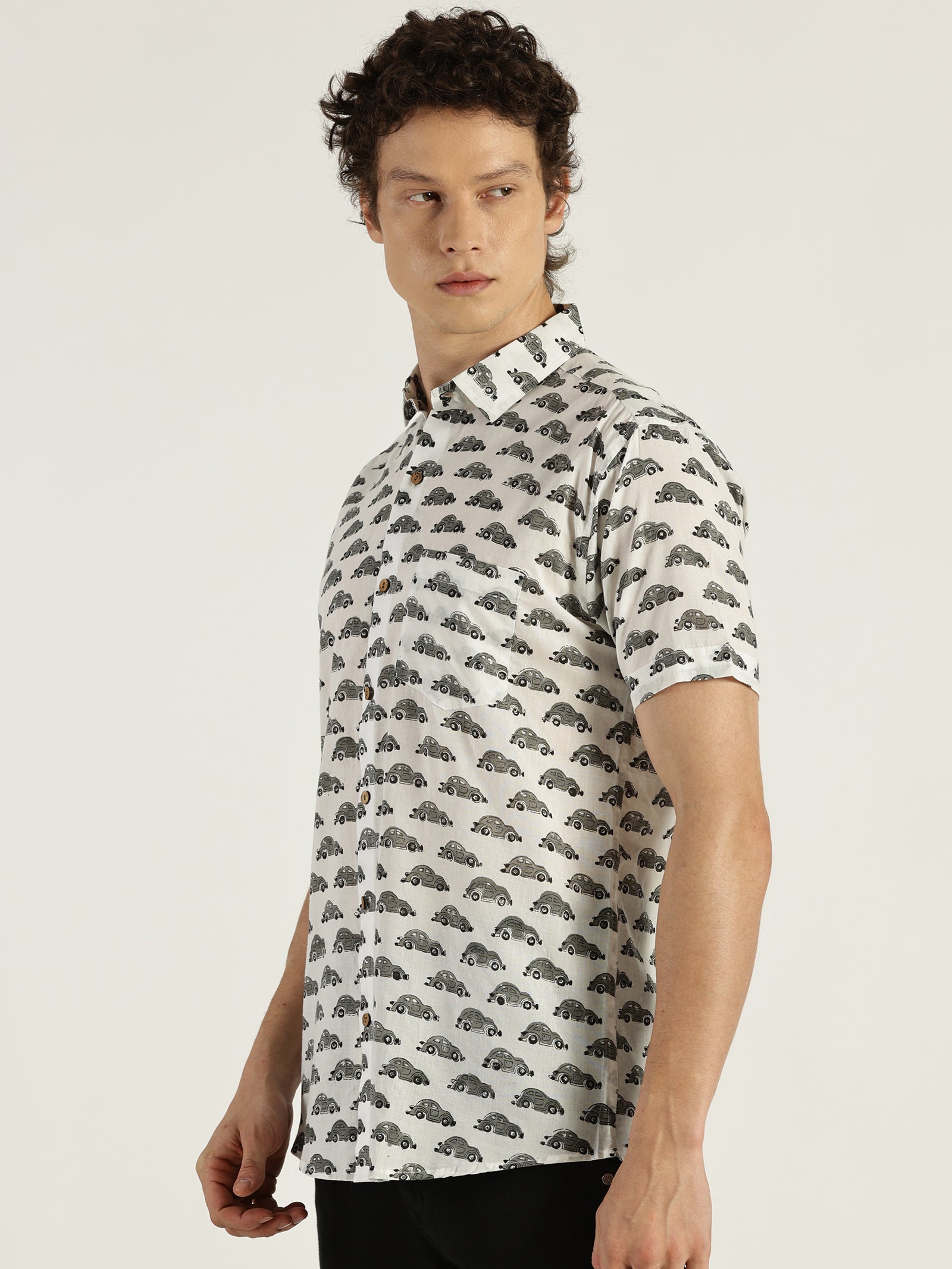 Model Looking sideways in Grey Car Block Printed Halfsleeves Cotton Shirt by Brand Patrah