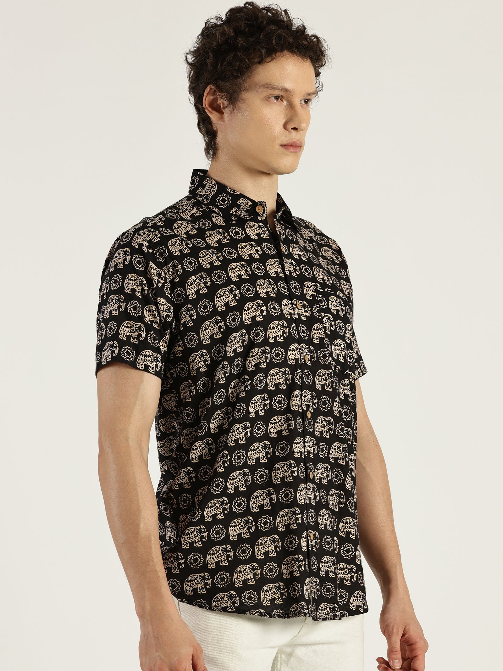 White Model wearing Black Ethnic Elephant Printed Halfsleeves Cotton Shirt by Brand Patrah