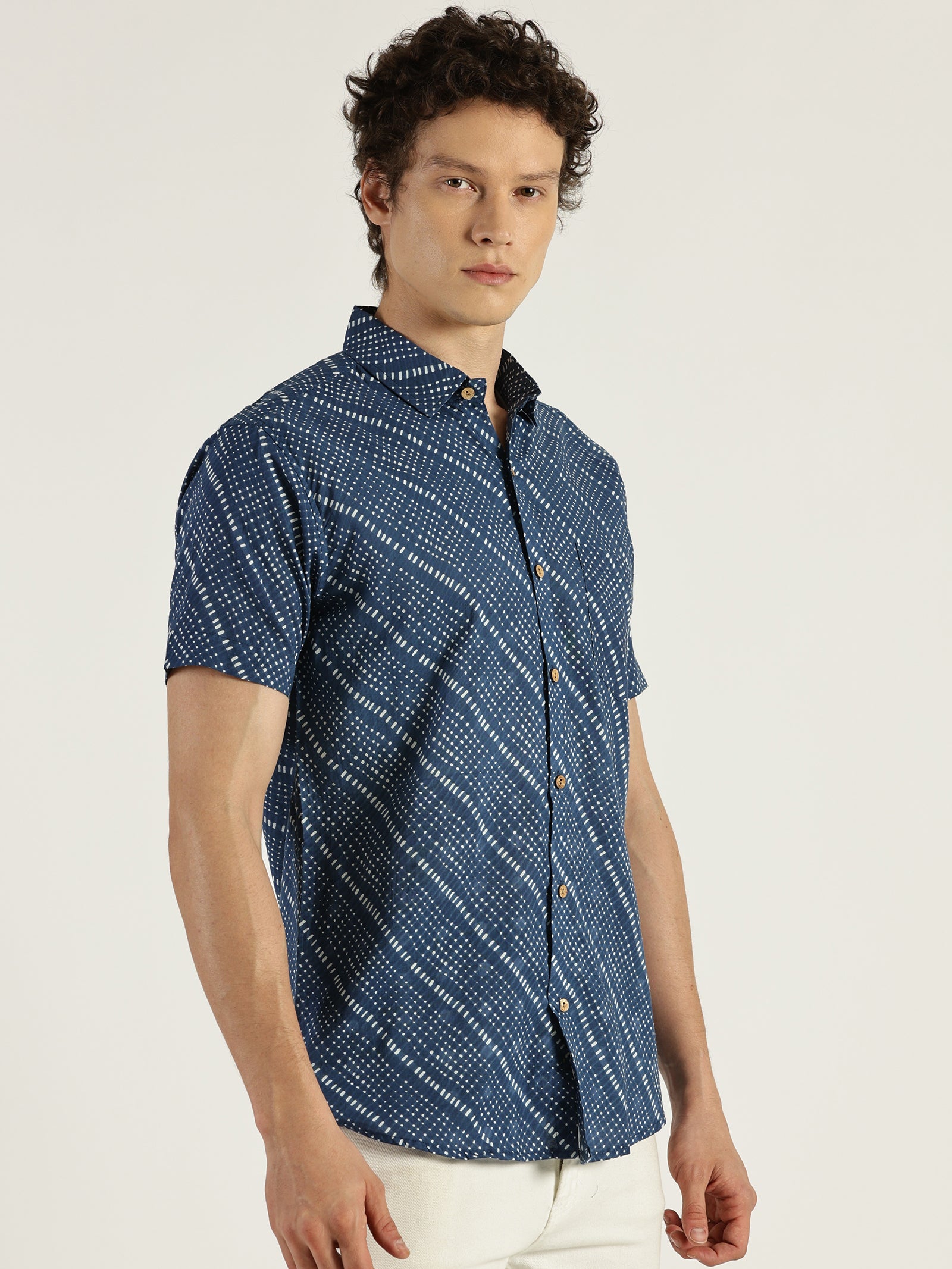 White Model wearing Blue Abstract Chex Printed Halfsleeves Cotton Shirt by Brand Patrah