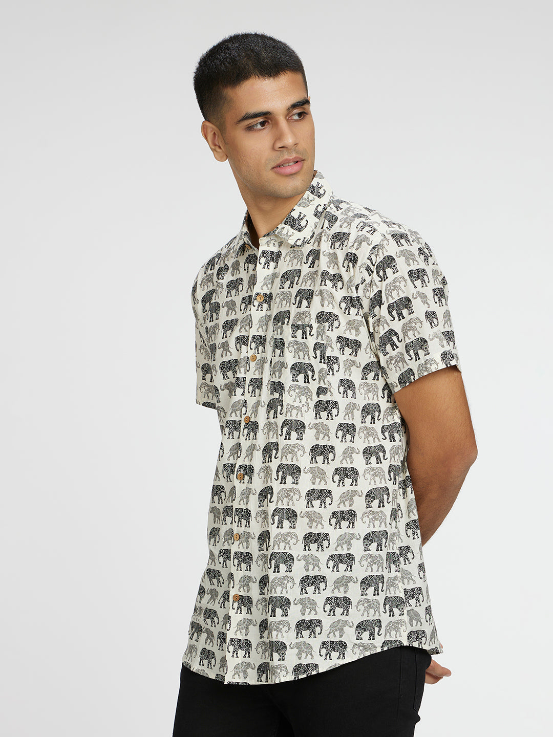 Model Facing sideways wearing Black and white Elephant graphic Printed Halfsleeves Cotton Shirt by Brand Patrah
