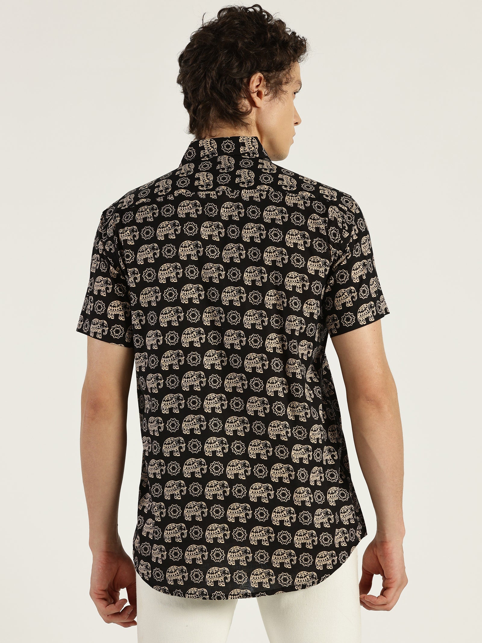 Model facing backwards wearing Black Ethnic Elephant Printed Halfsleeves Cotton Shirt by Brand Patrah