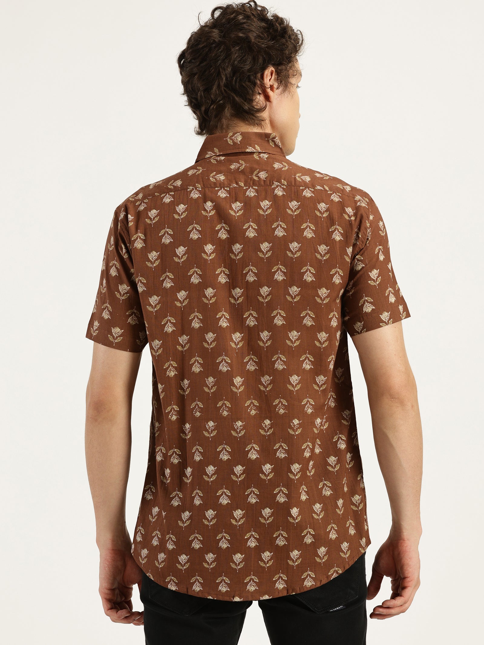 Model facing backwards wearing Earthy Brown Floral Printed Halfsleeves Cotton Shirt by Brand Patrah