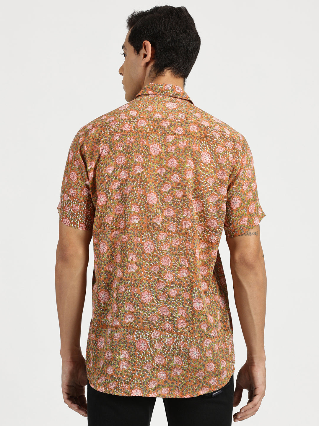 Model facing backwards wearing Rusty Blossom Block Printed Halfsleeves Mulmul Cotton Shirt by Brand Patrah