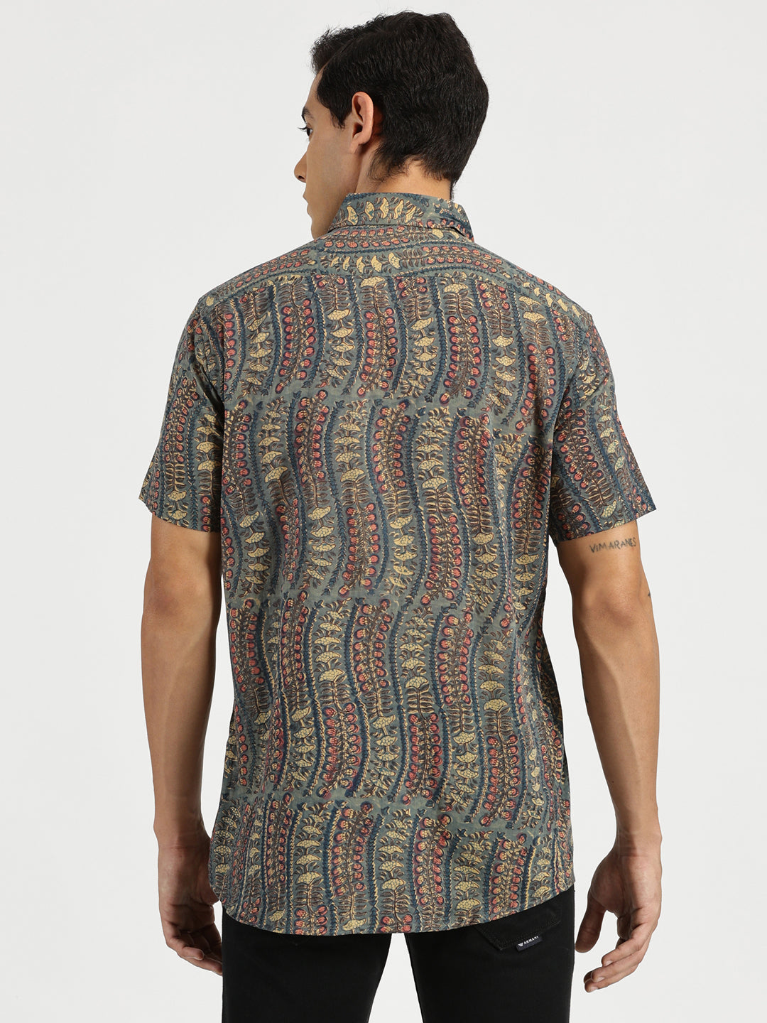 Model facing backwards wearing Emerald Nomad Block Printed Halfsleeves Mulmul Cotton Shirt by Brand Patrah