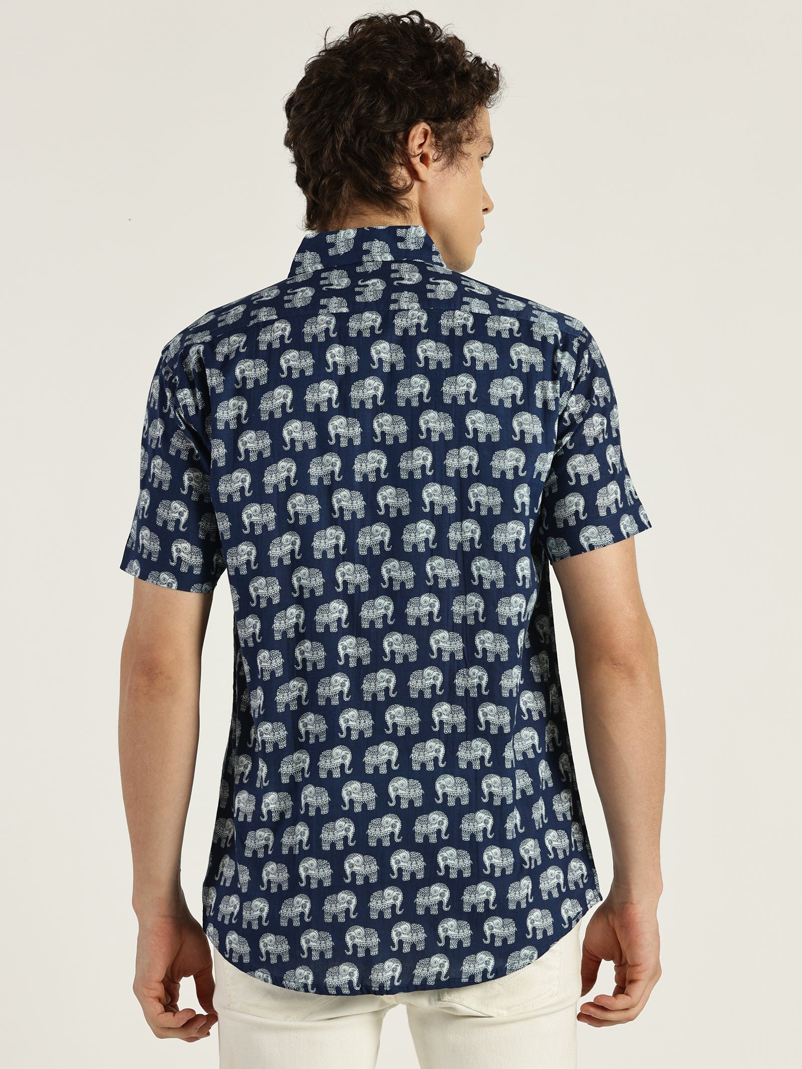 Model facing backwards wearing Indigo Ethnic Elephant Printed Halfsleeves Cotton Shirt by Brand Patrah