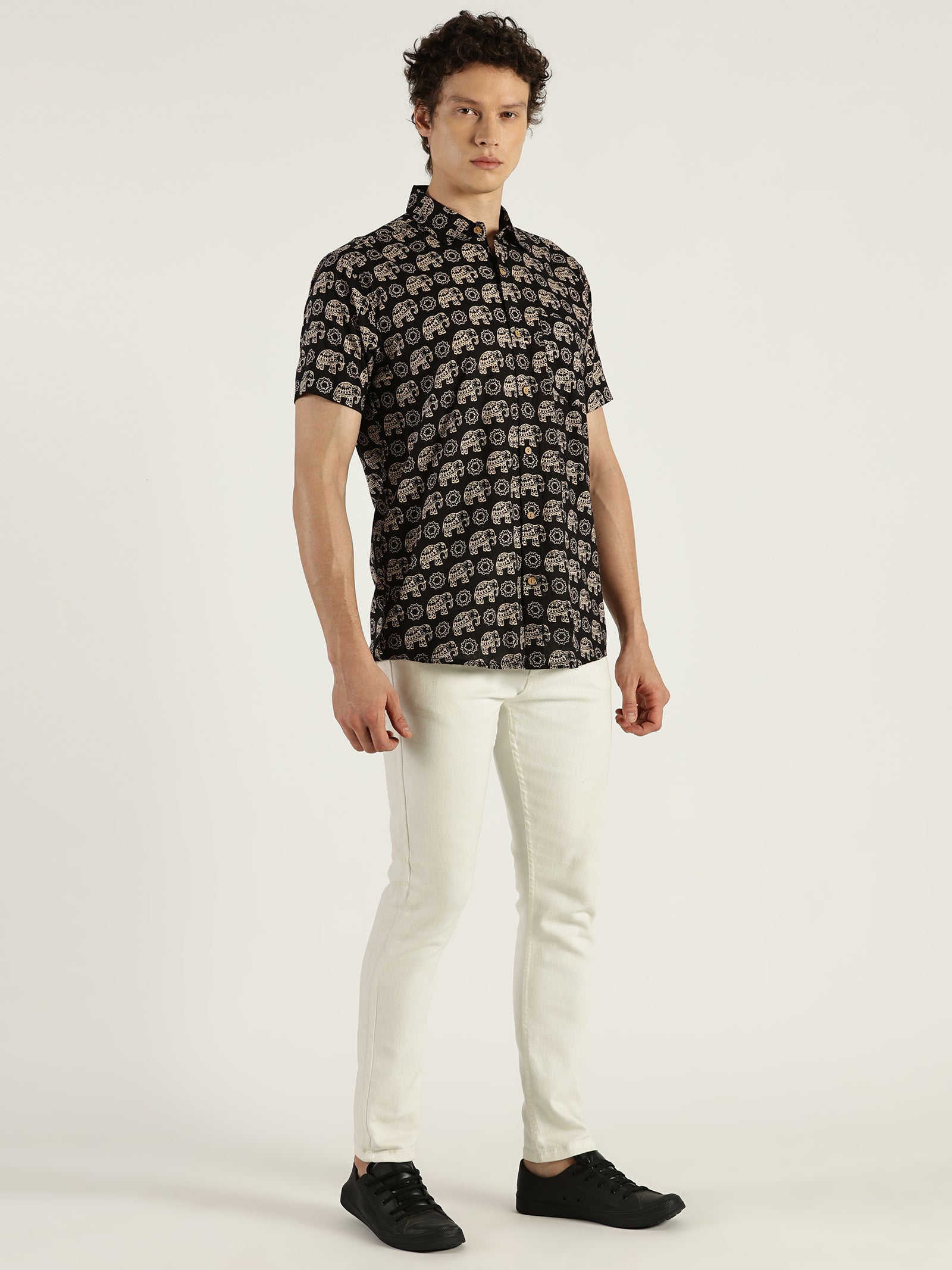 White Model wearing Black Ethnic Elephant Printed Halfsleeves Cotton Shirt by Brand Patrah