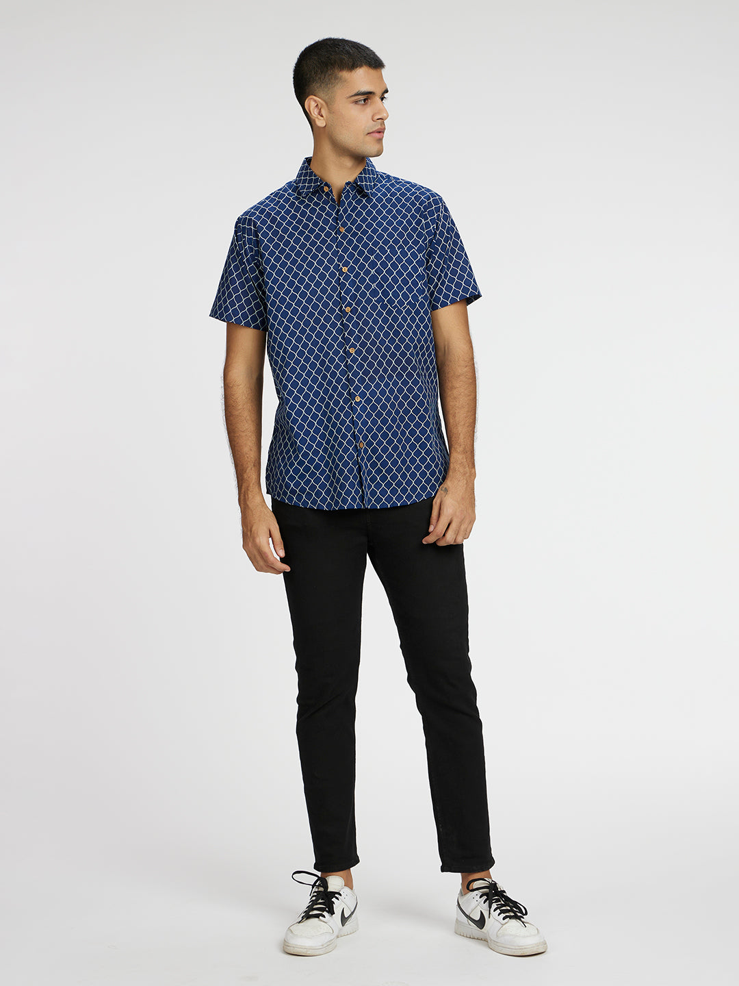 Model Facing sideways wearing Blue Designer Wavestripe Printed Halfsleeves Cotton Shirt by Brand Patrah