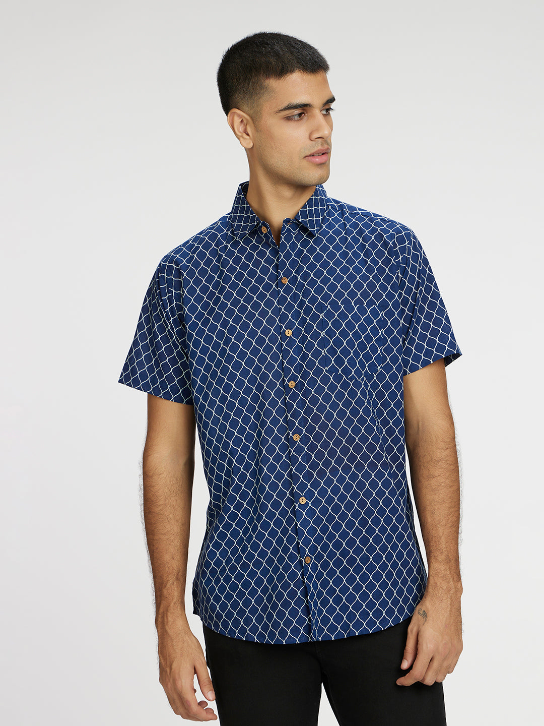Model Facing sideways wearing Blue Designer Wavestripe Printed Halfsleeves Cotton Shirt by Brand Patrah