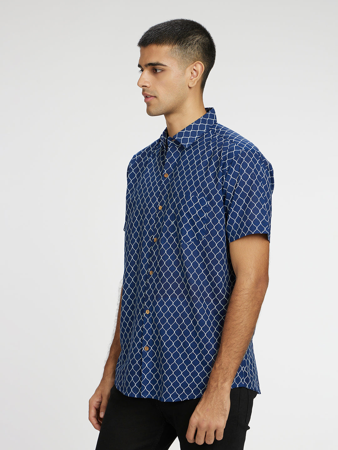 Model Facing sideways wearing Blue Designer Wavestripe Printed Halfsleeves Cotton Shirt by Brand Patrah