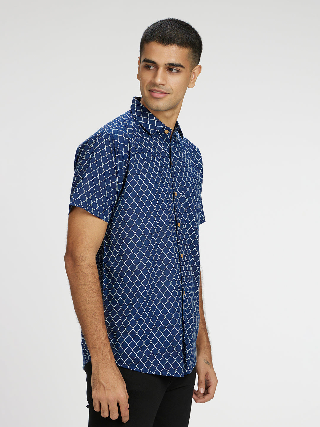 Model Facing sideways wearing Blue Designer Wavestripe Printed Halfsleeves Cotton Shirt by Brand Patrah
