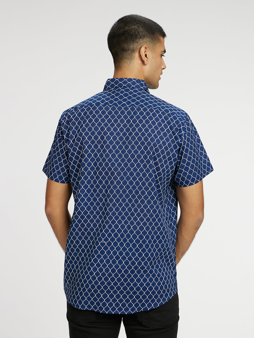 Model facing backwards wearing Blue Designer Wavestripe Printed Halfsleeves Cotton Shirt by Brand Patrah