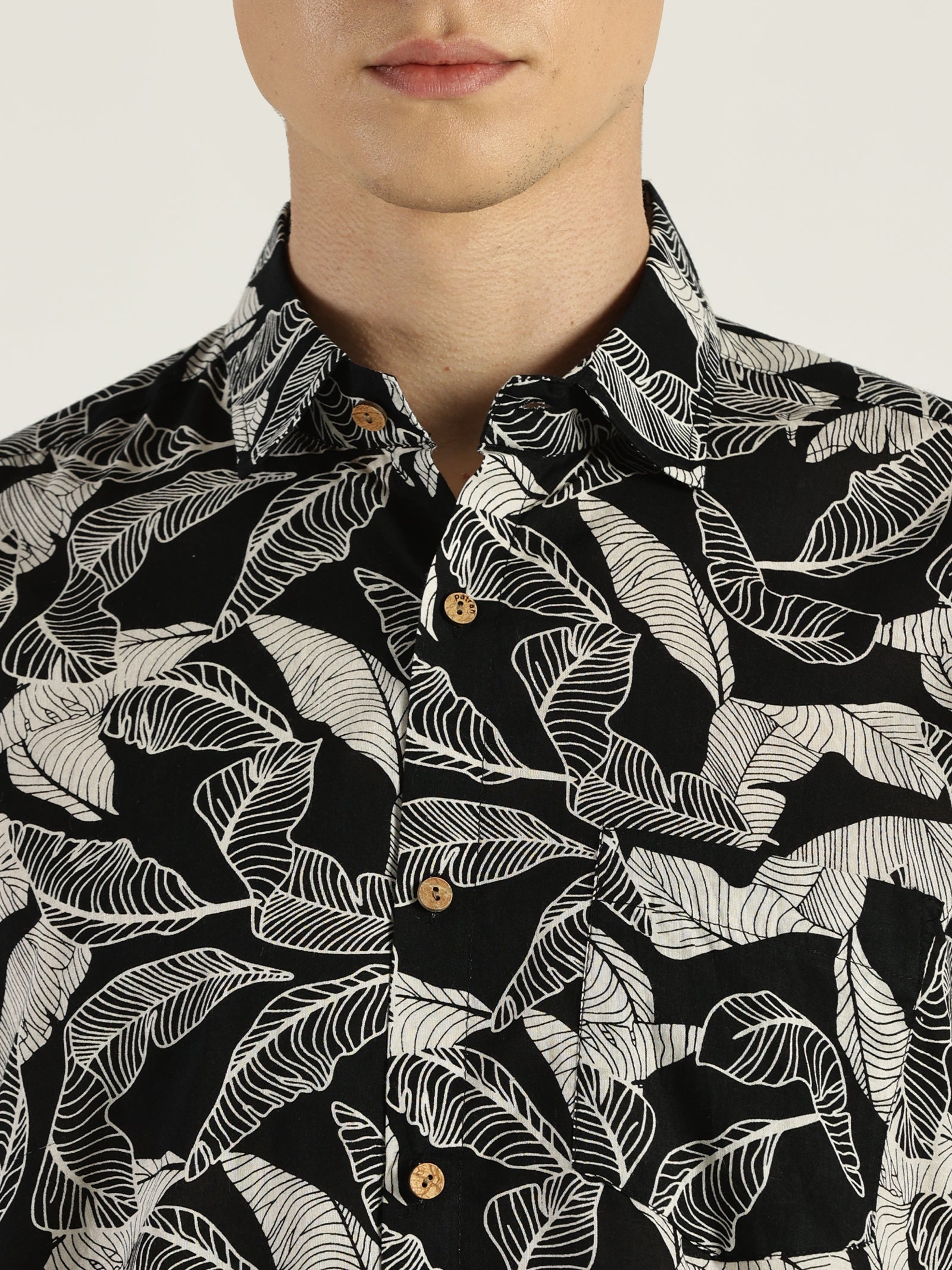 Close up of Tropical Leaf Black Printed Halfsleeves Cotton Shirt by Brand Patrah