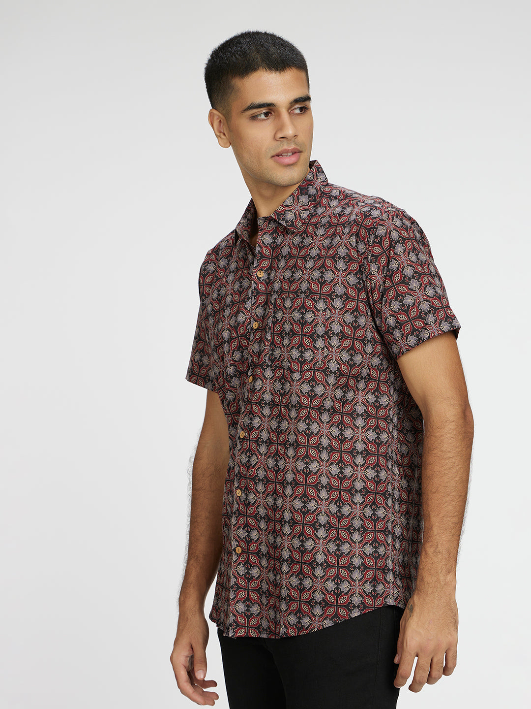 Model Facing sideways wearing Ethnic Ajrak Printed Halfsleeves Cotton Shirt by Brand Patrah