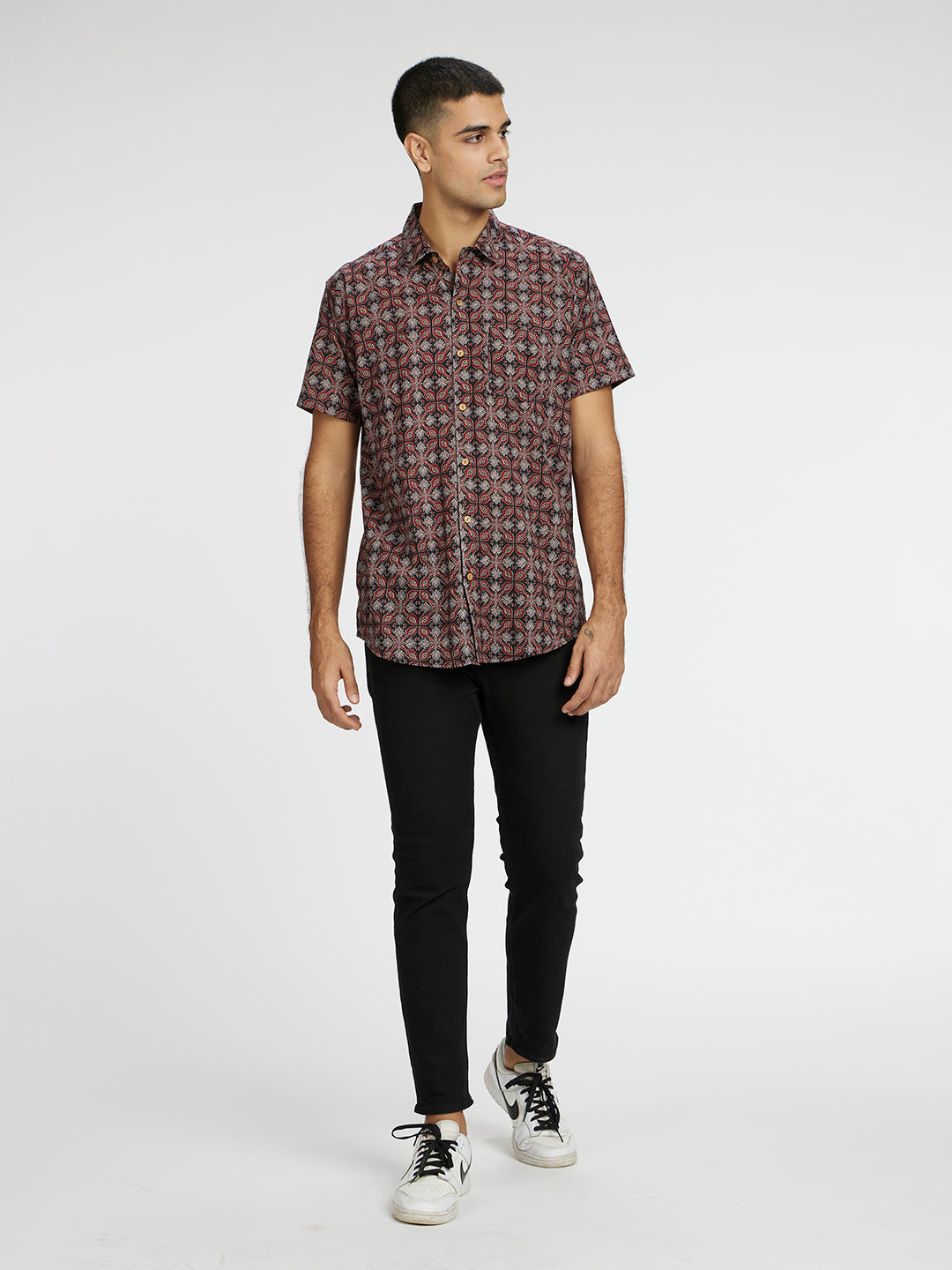 Model Facing sideways wearing Ethnic Ajrak Printed Halfsleeves Cotton Shirt by Brand Patrah