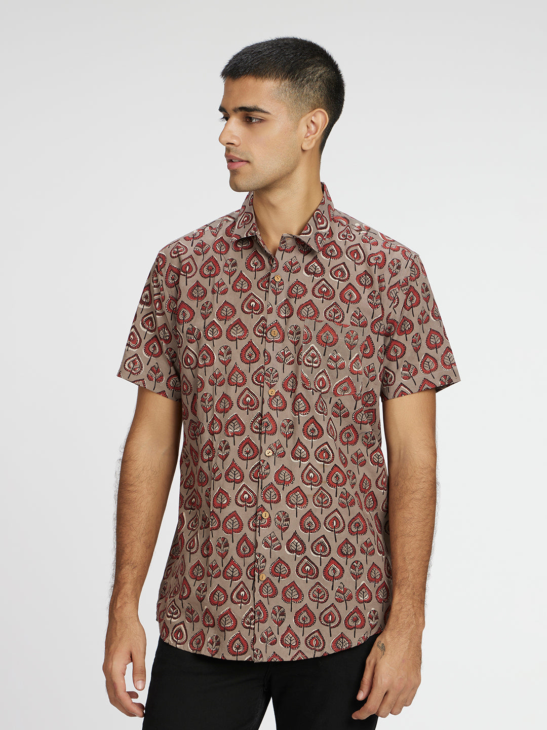 Model Facing sideways wearing Grey Leaf Block Printed Holiday Halfsleeves Cotton Shirt by Brand Patrah