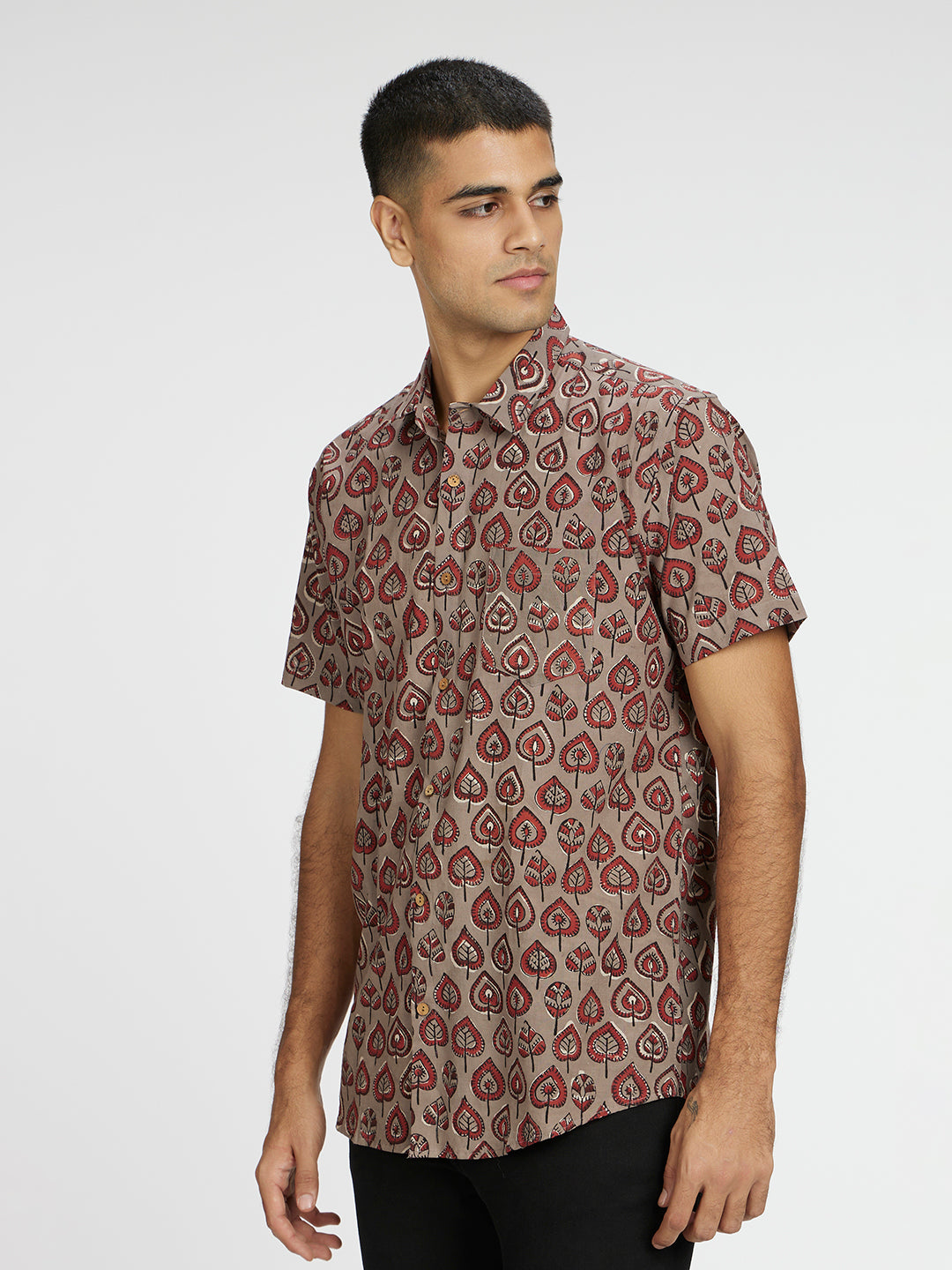 Model Facing sideways wearing Grey Leaf Block Printed Holiday Halfsleeves Cotton Shirt by Brand Patrah