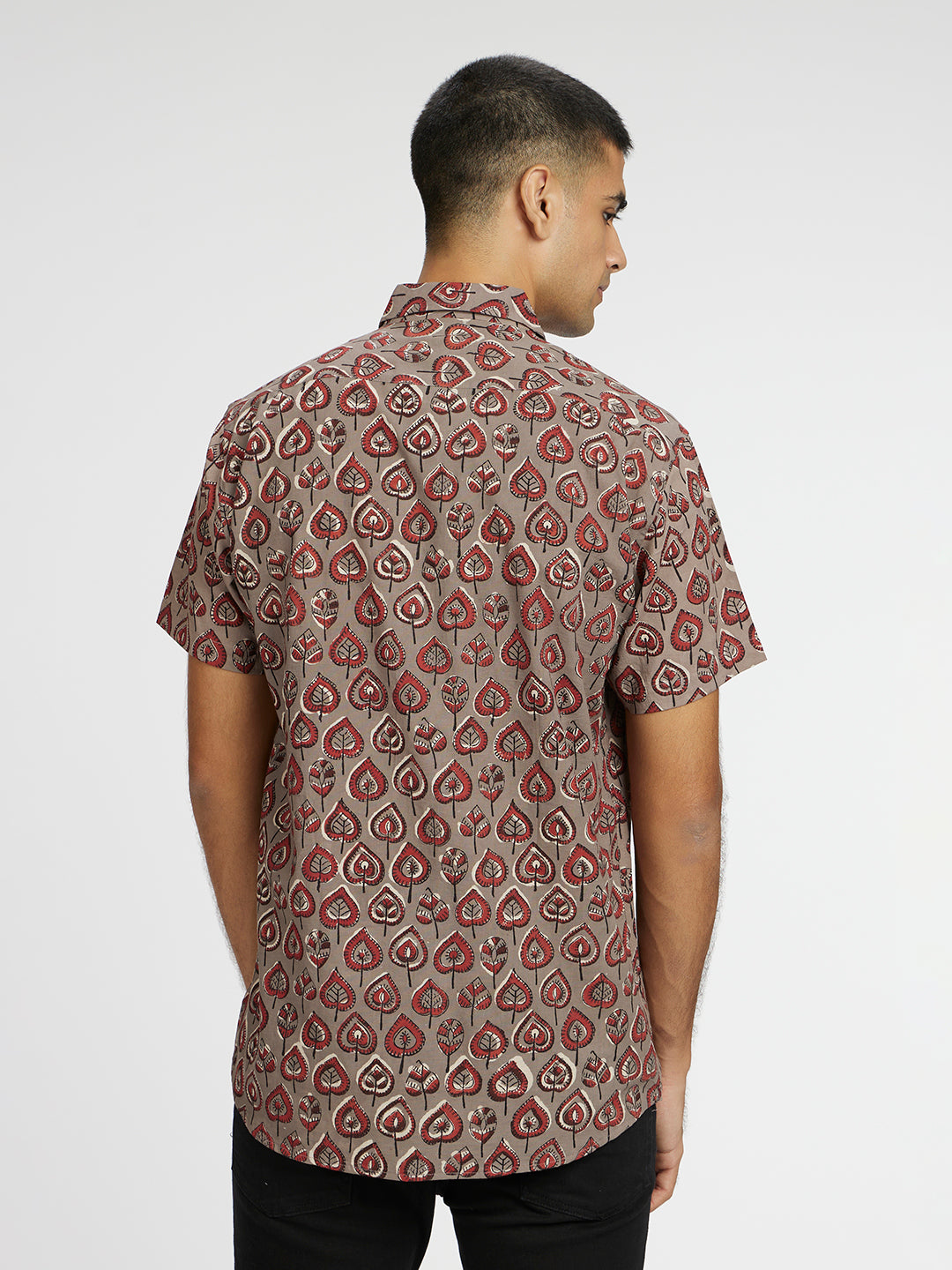 Model facing backwards wearing Grey Leaf Block Printed Holiday Halfsleeves Cotton Shirt by Brand Patrah