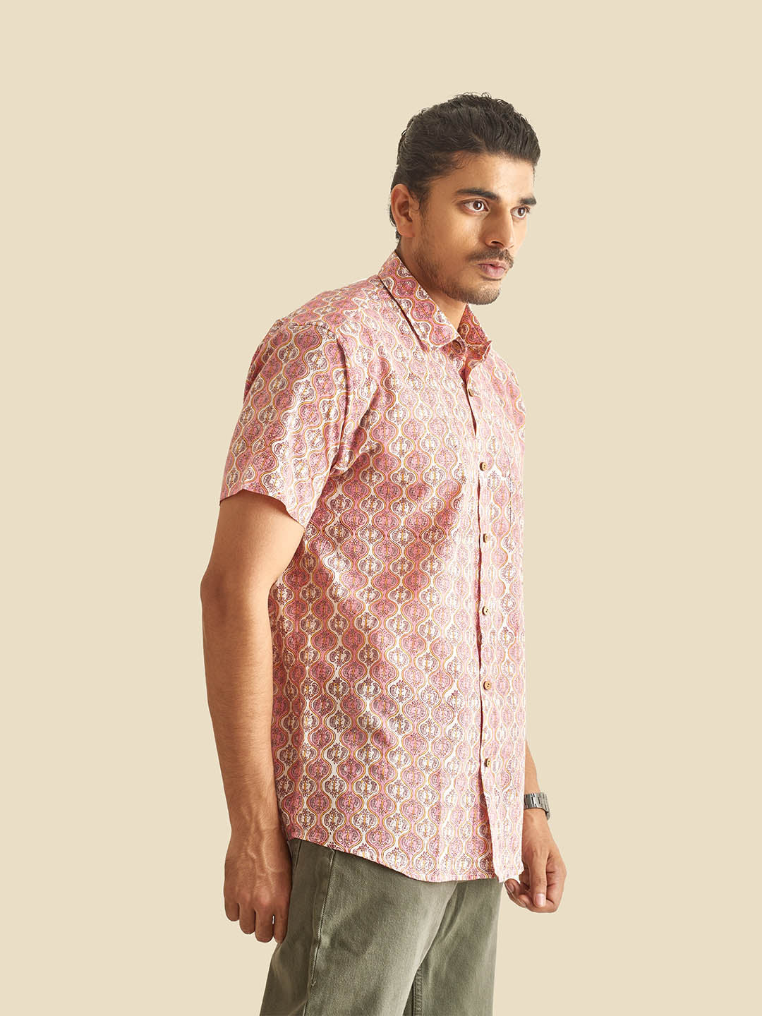 Model Facing sideways wearing Pink and White Ethnic Block Printed Holiday Halfsleeves Cotton Shirt by Brand Patrah