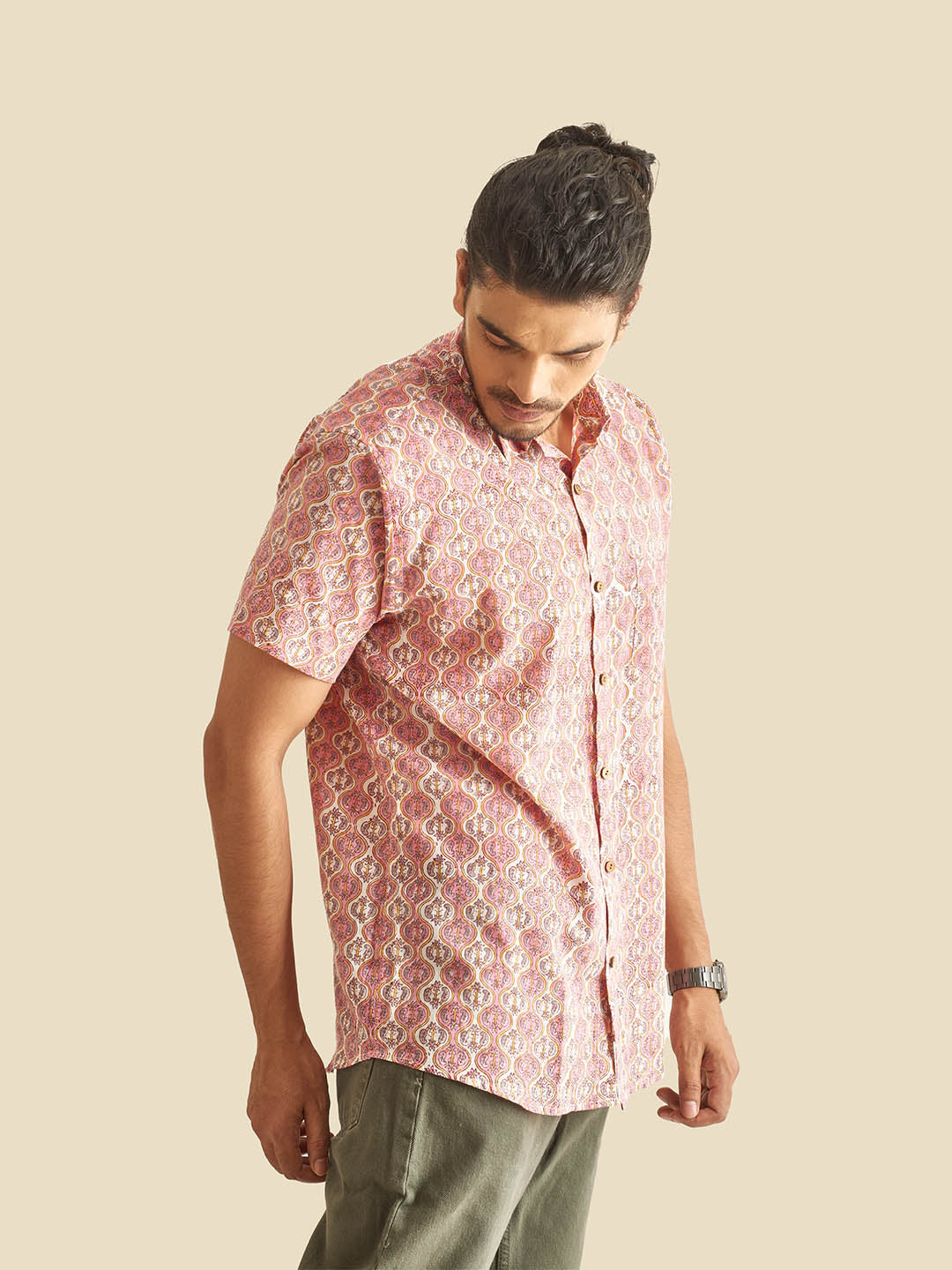 Model Facing sideways wearing Pink and White Ethnic Block Printed Holiday Halfsleeves Cotton Shirt by Brand Patrah