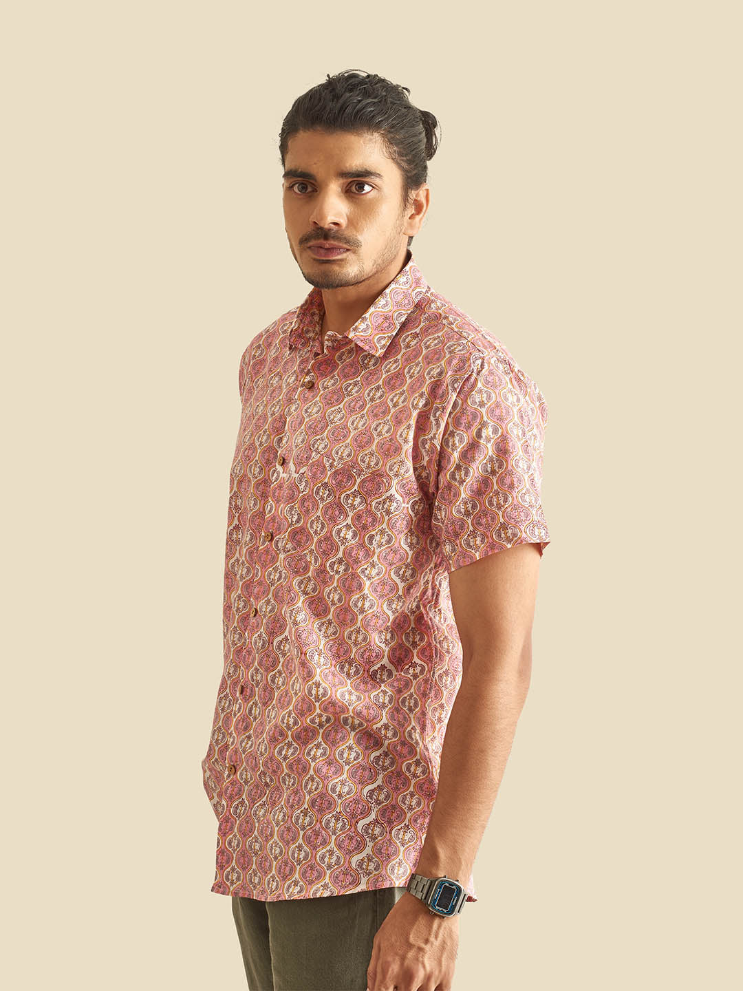 Model Facing sideways wearing Pink and White Ethnic Block Printed Holiday Halfsleeves Cotton Shirt by Brand Patrah