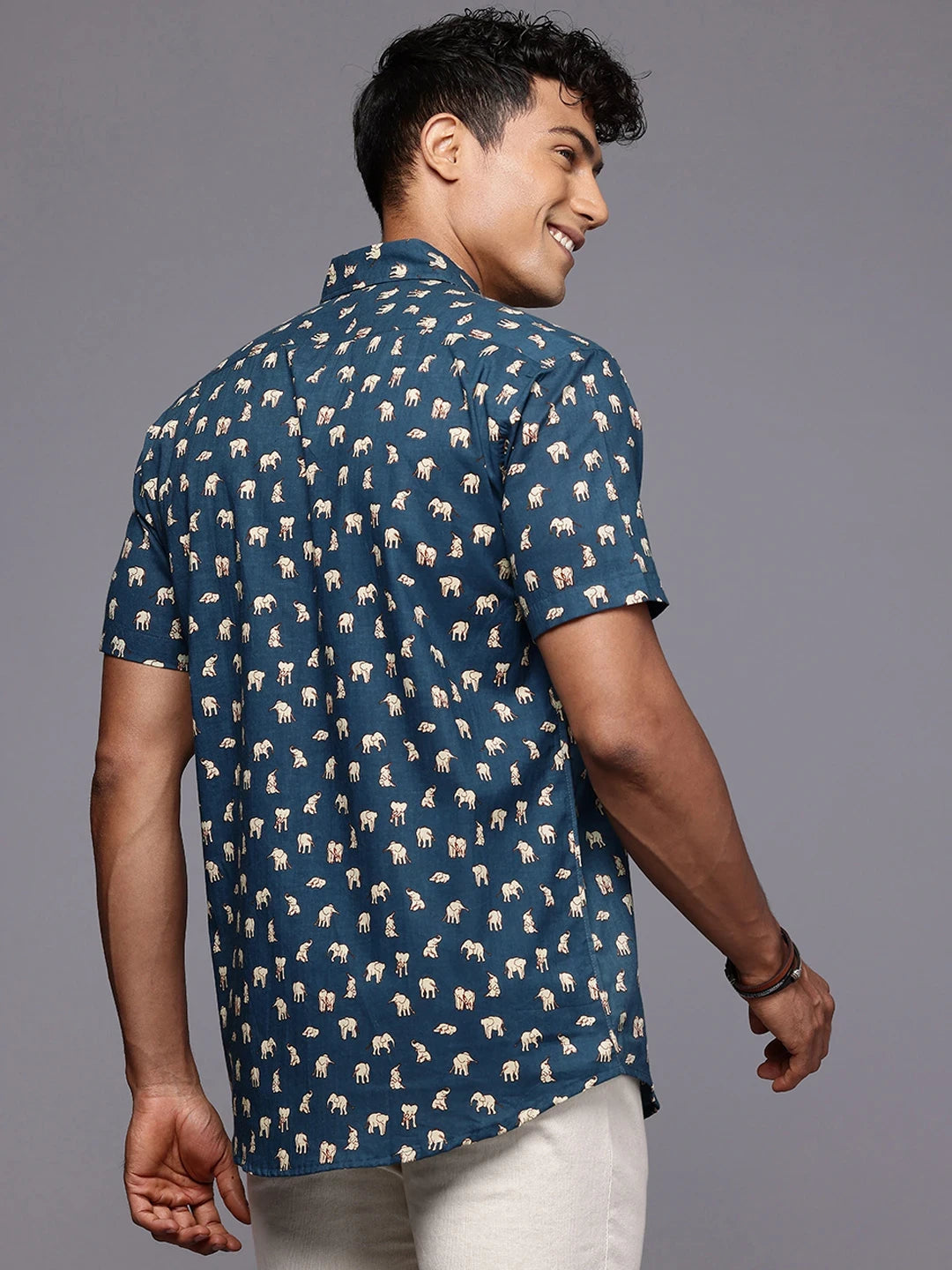 Back view of men’s cotton shirt with elephant print design