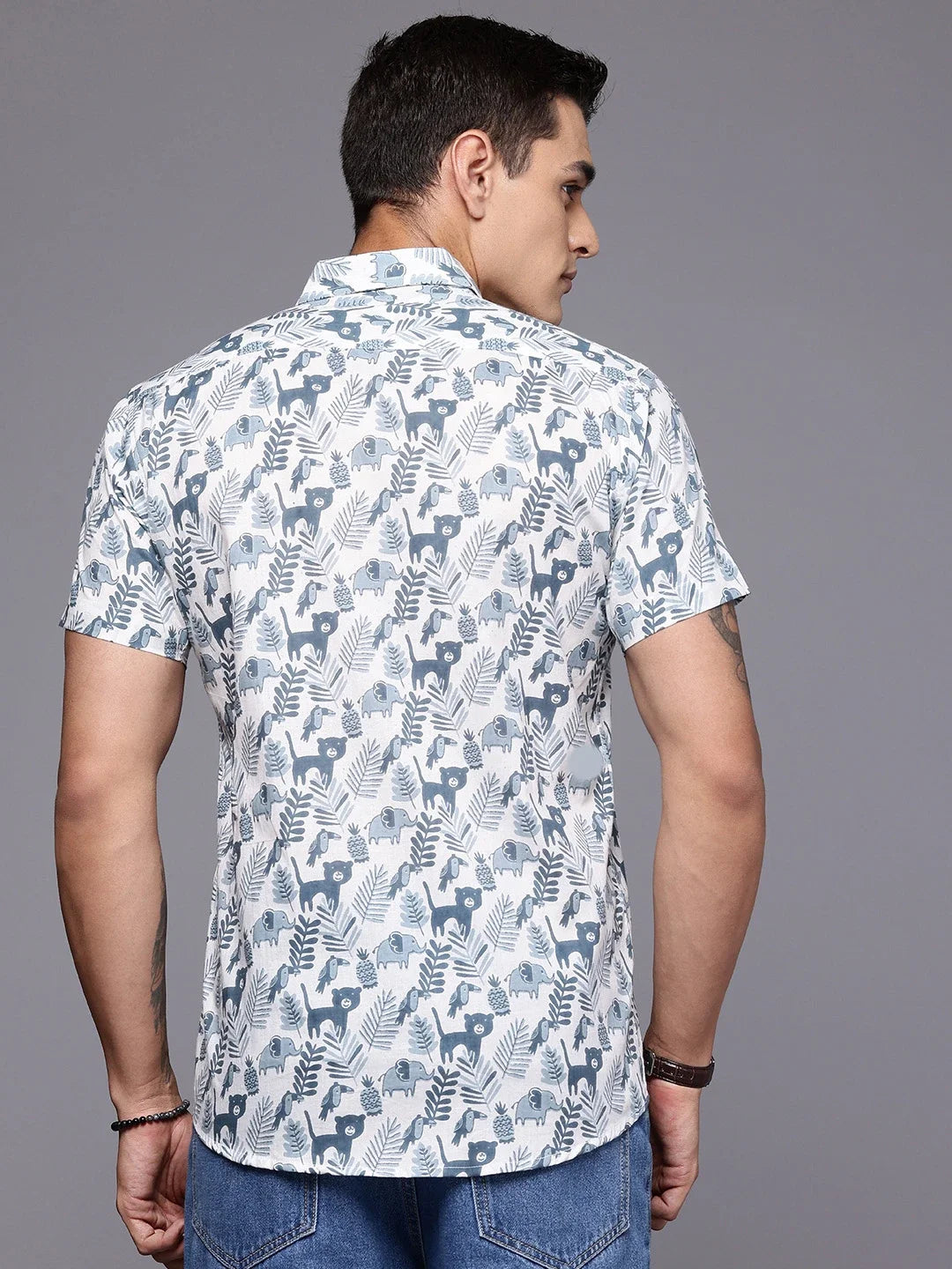 Back view of men’s cotton shirt with safari print for travel styling