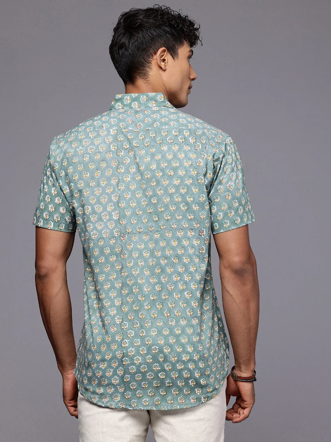 Back view of men’s olive cotton shirt with floral design