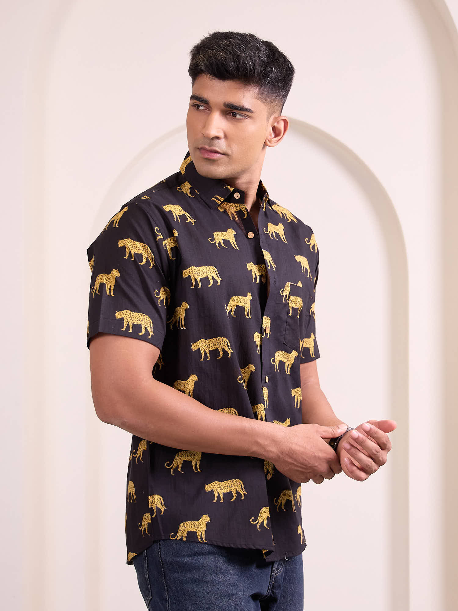 Side profile of man in cheetah print shirt for holiday styling