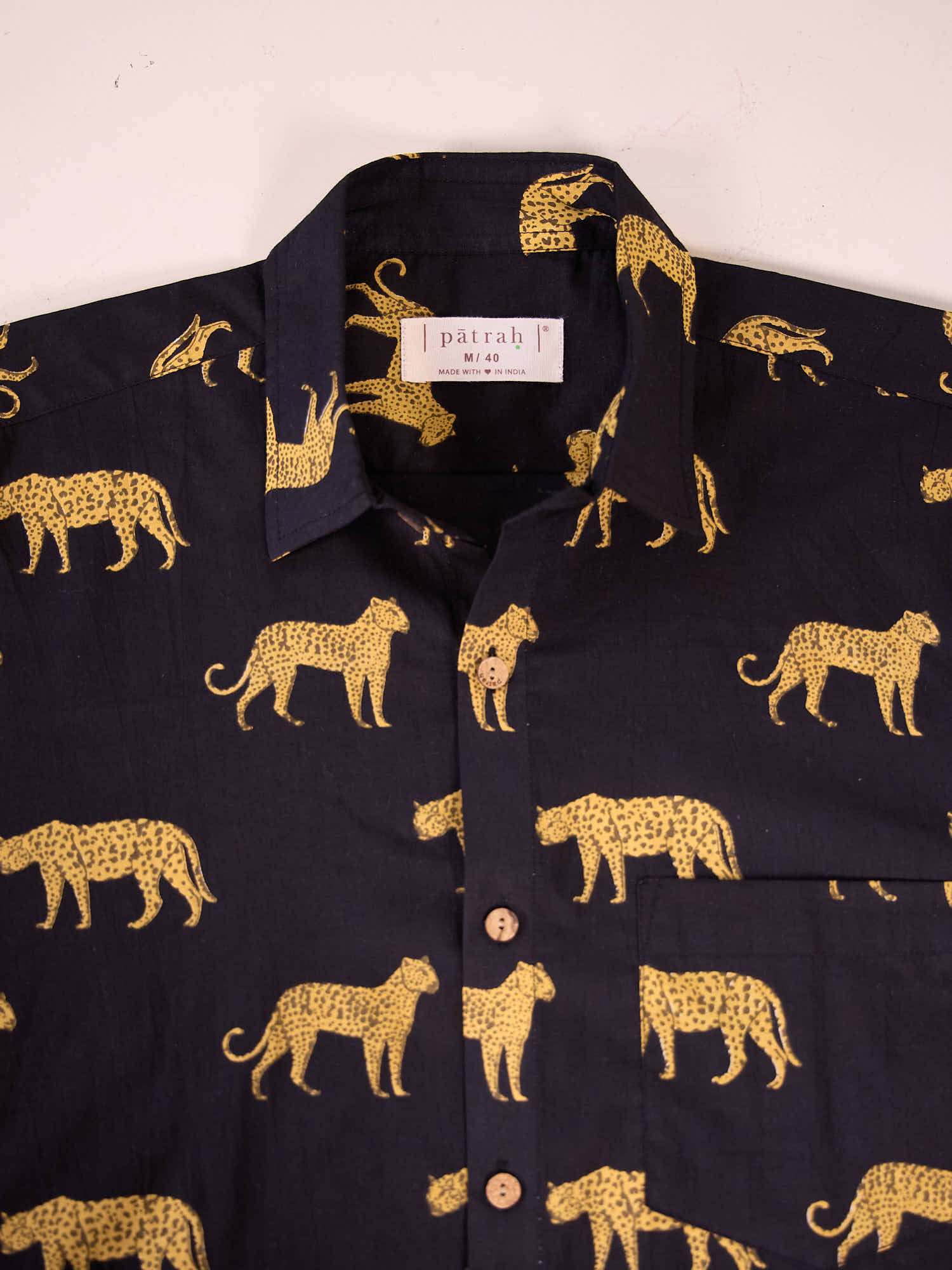 Close-up of cheetah print cotton fabric showing pattern and texture