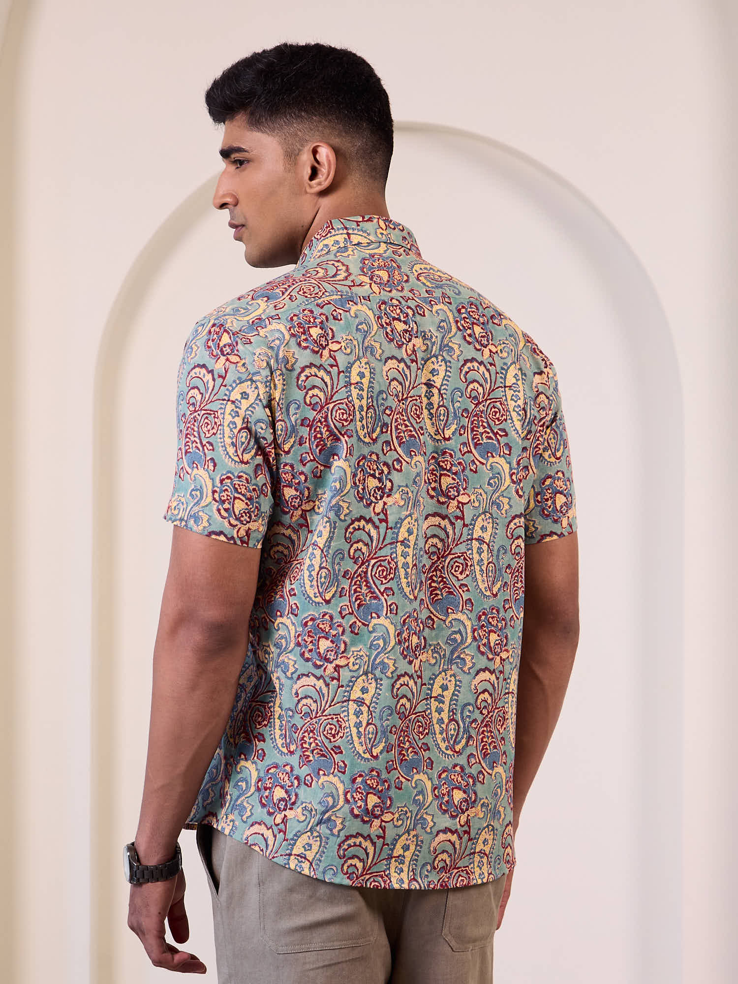 Model wearing printed casual short sleeve shirt back design