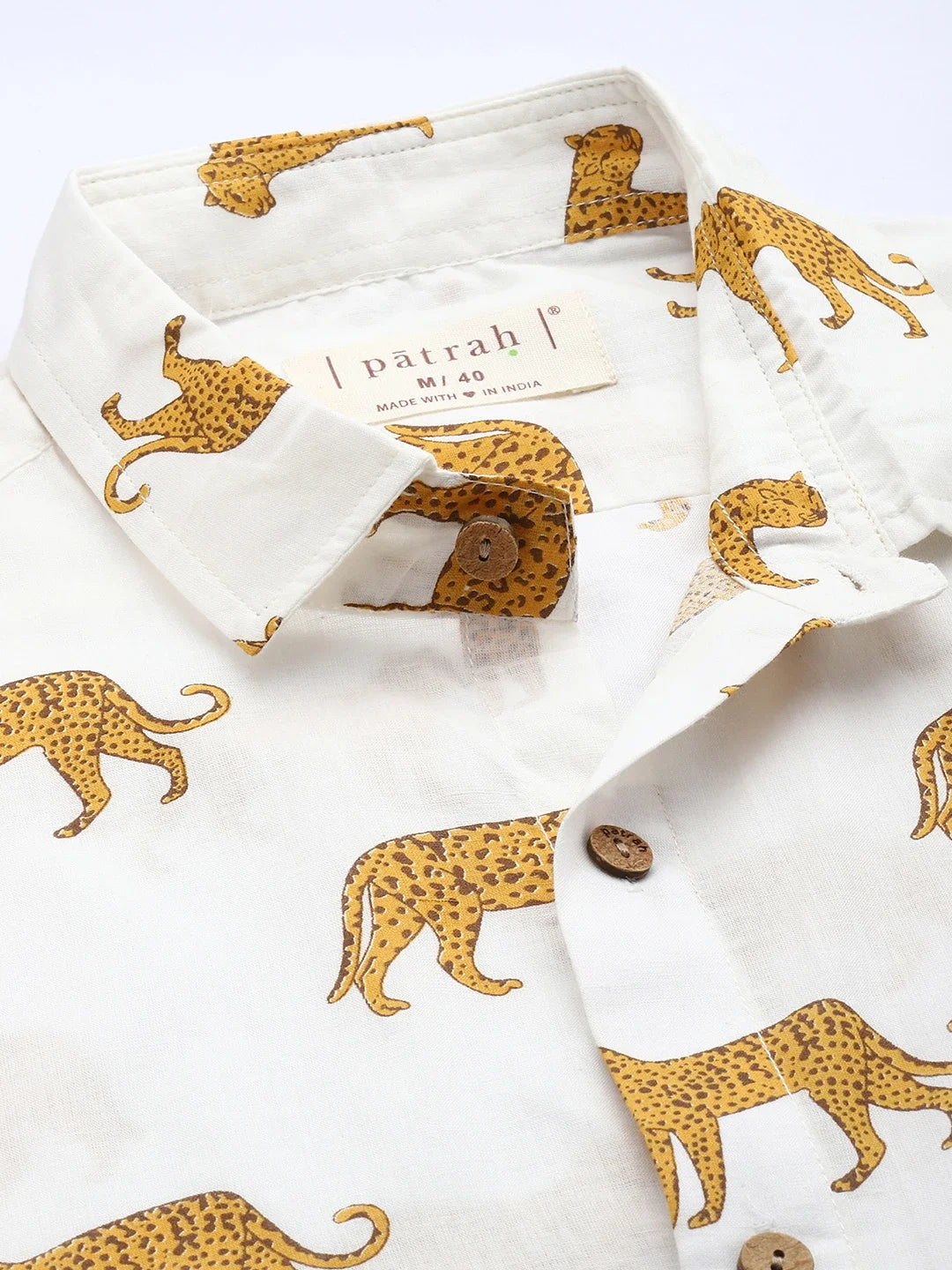 Close-up of cheetah print cotton fabric showing pattern and texture