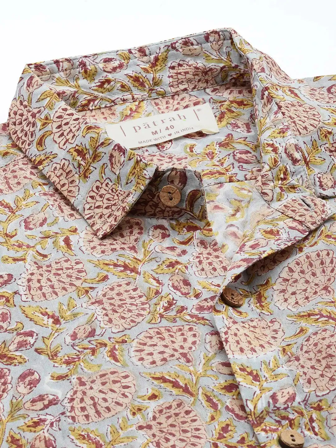 Close-up of vintage floral cotton fabric showing detailed print