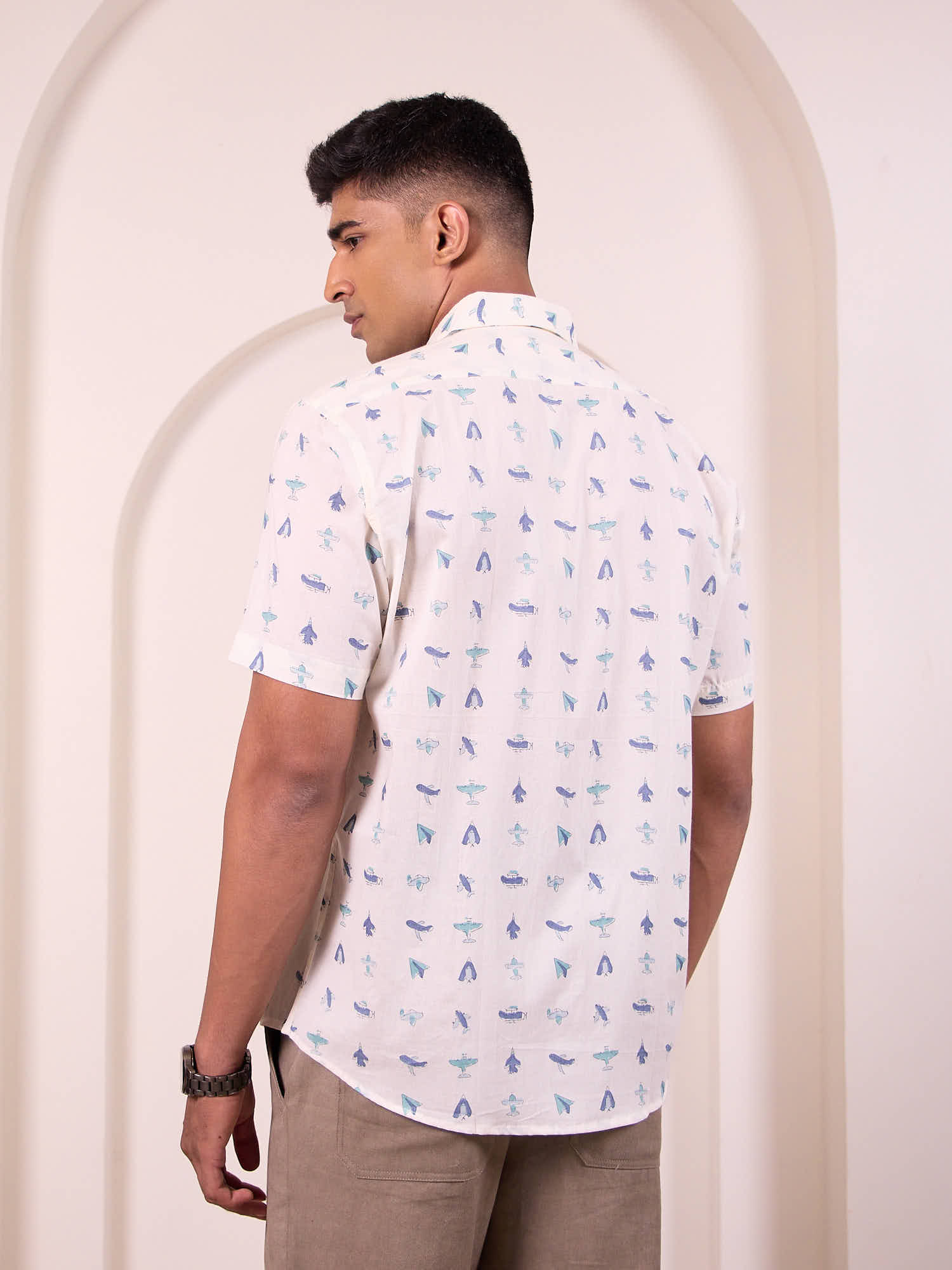 Model facing backwards wearing flying blue Print Cotton Shirt