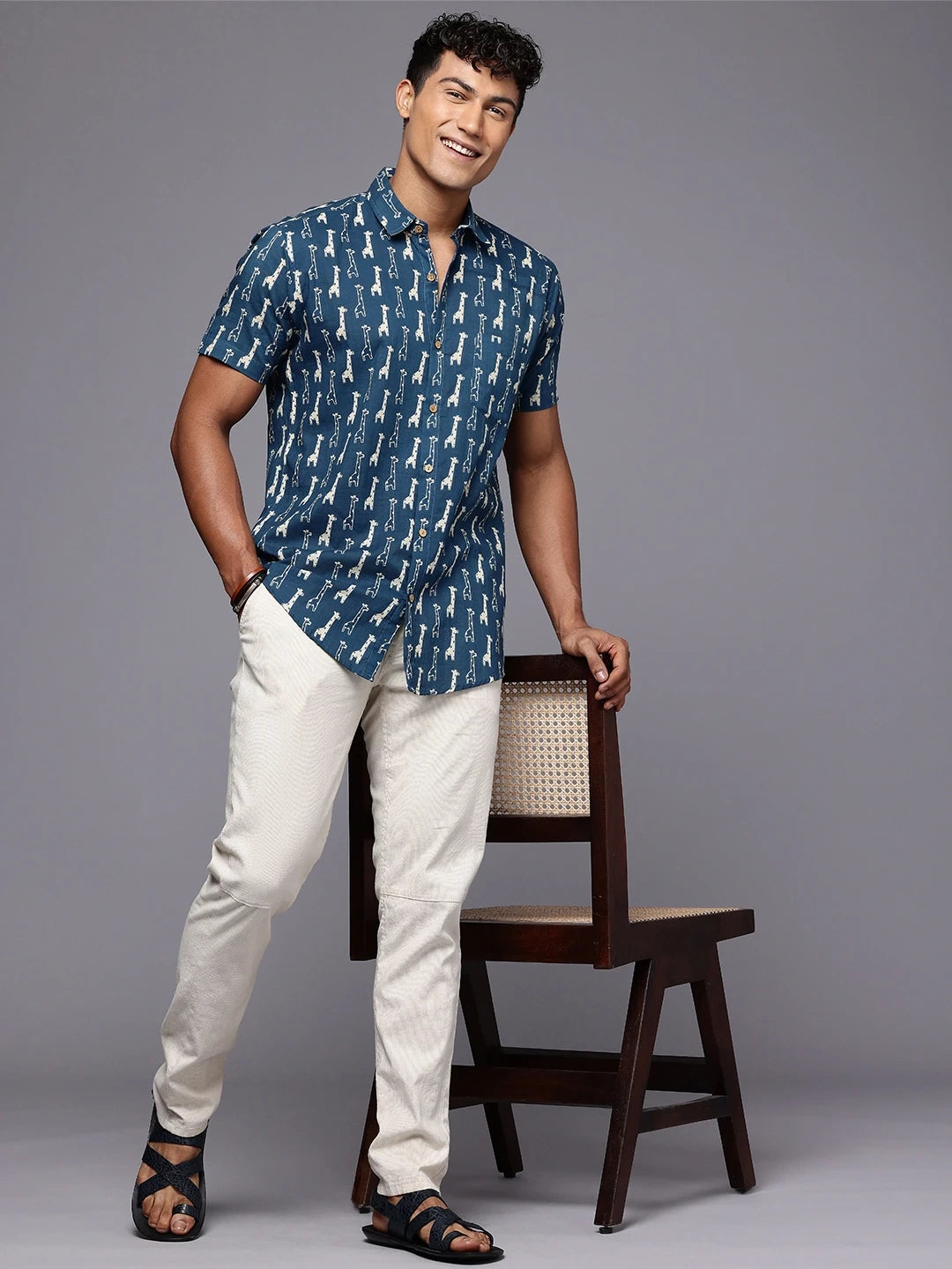 Full body view of men’s giraffe print shirt for beach or casual wear