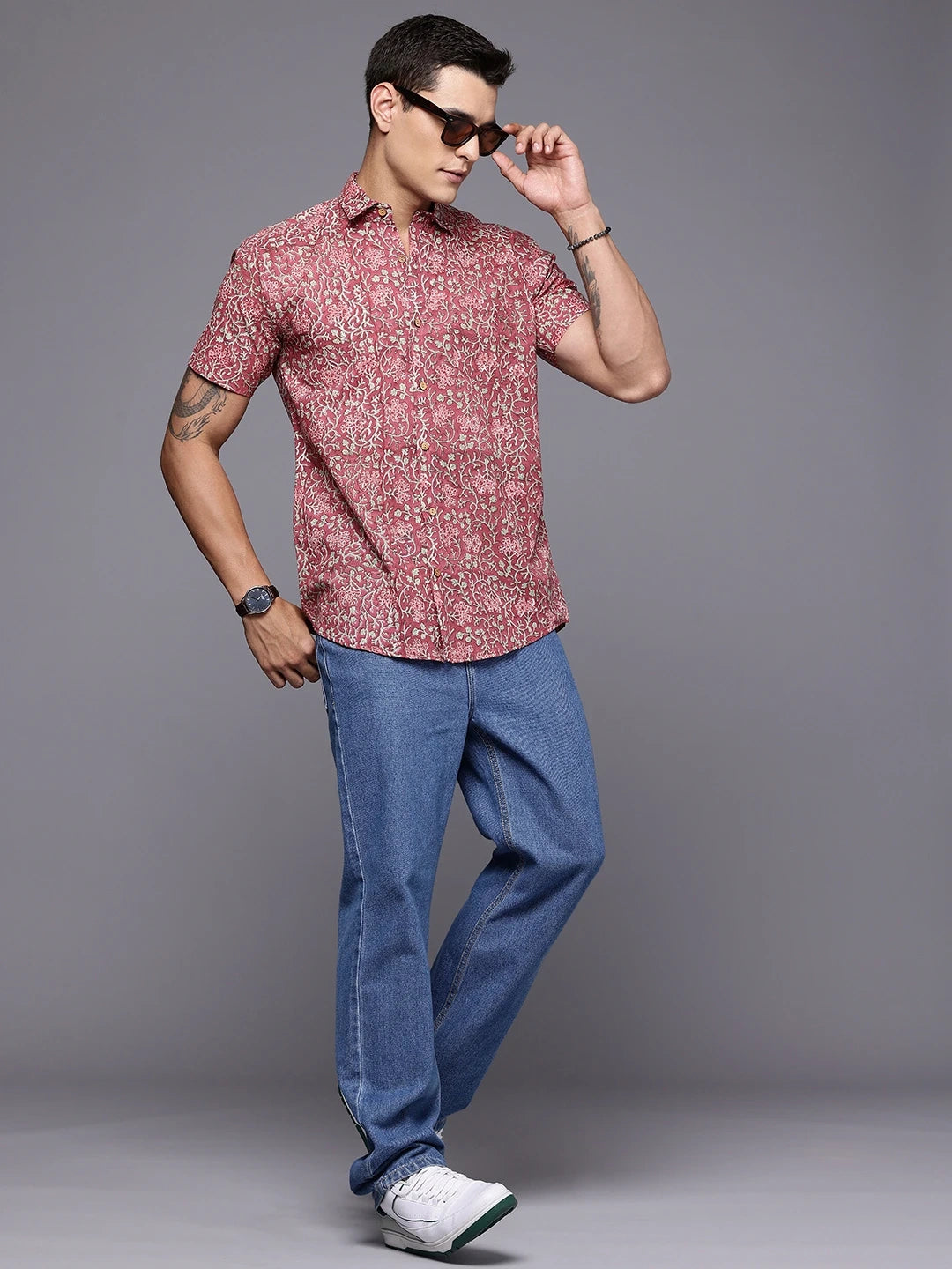 Full view of man in rouge floral print cotton shirt for relaxed styling