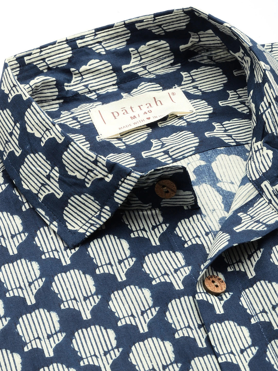 Patterned shirt with a visible brand label on a white background