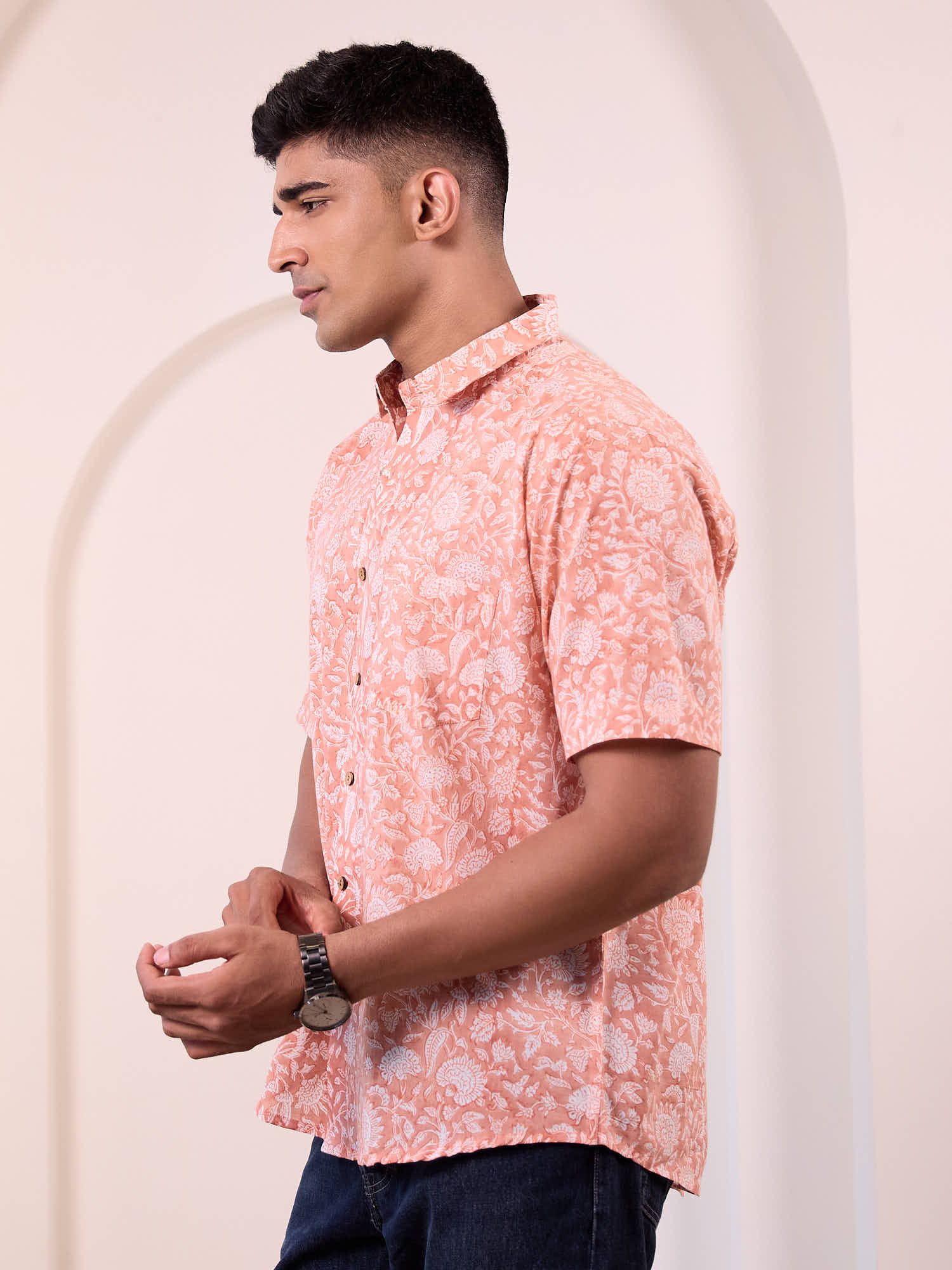 Model wearing printed shirt side profile