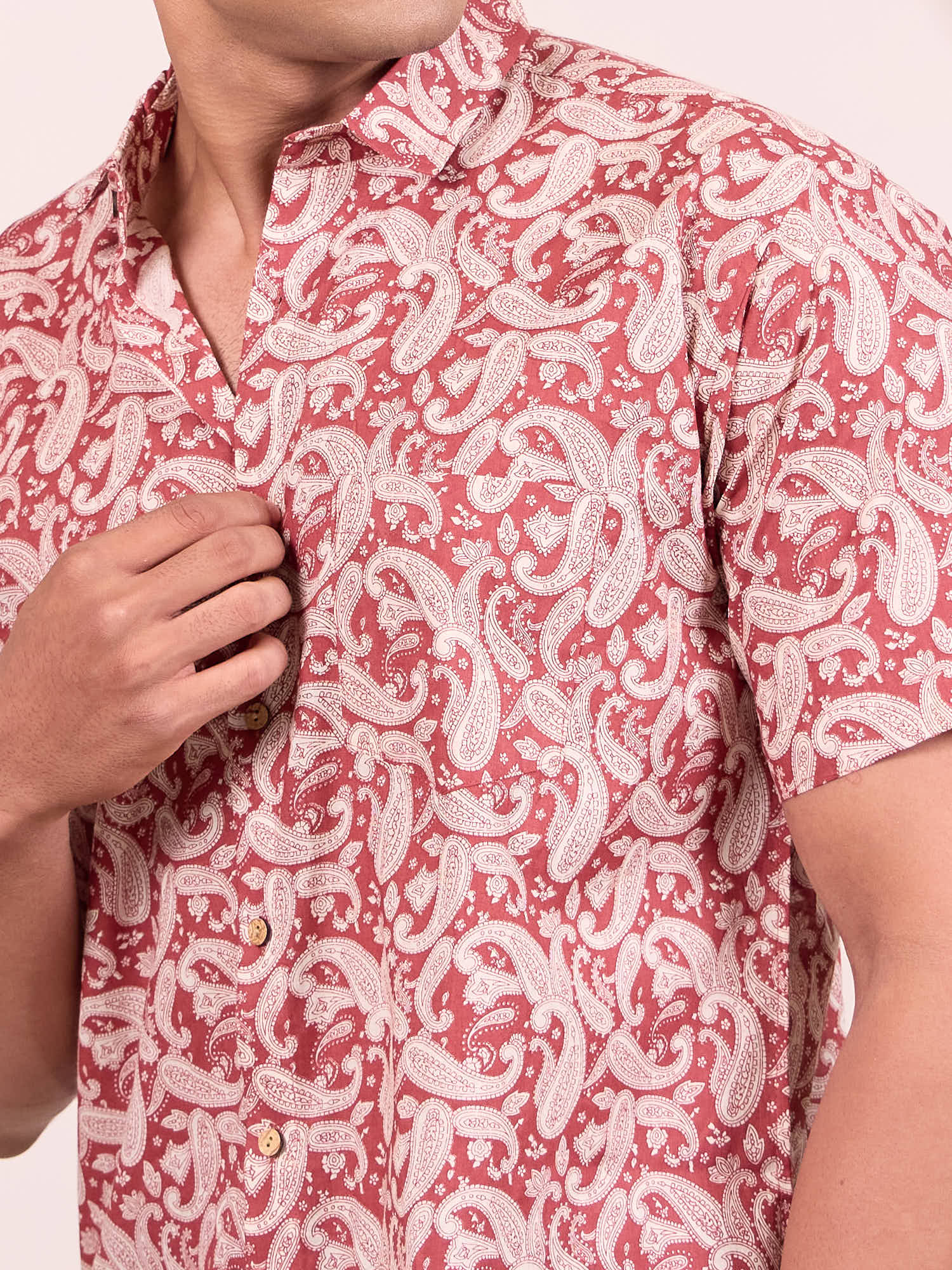 Red and white patterned shirt worn by a model