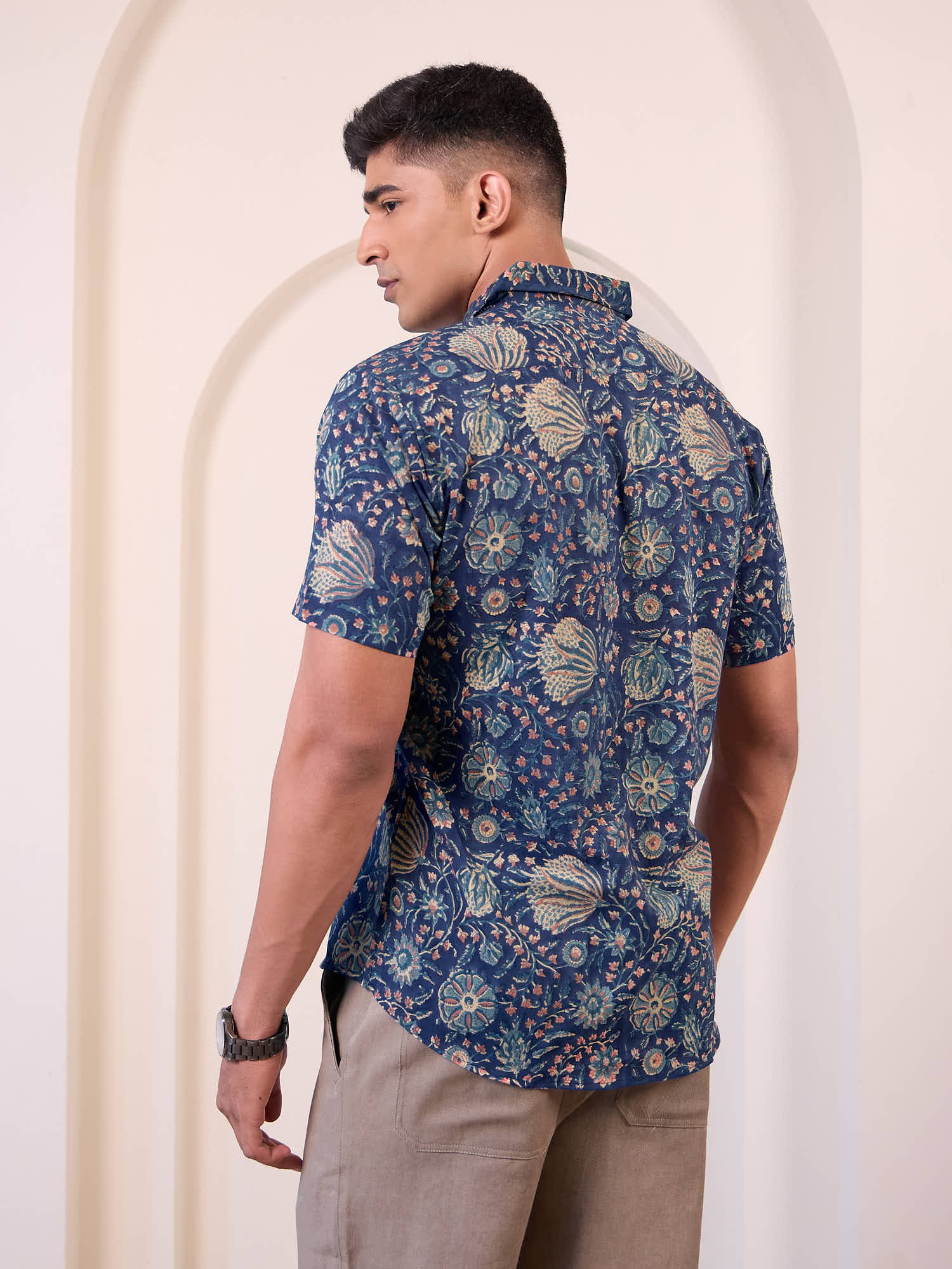Model wearing printed short sleeve casual shirt back design