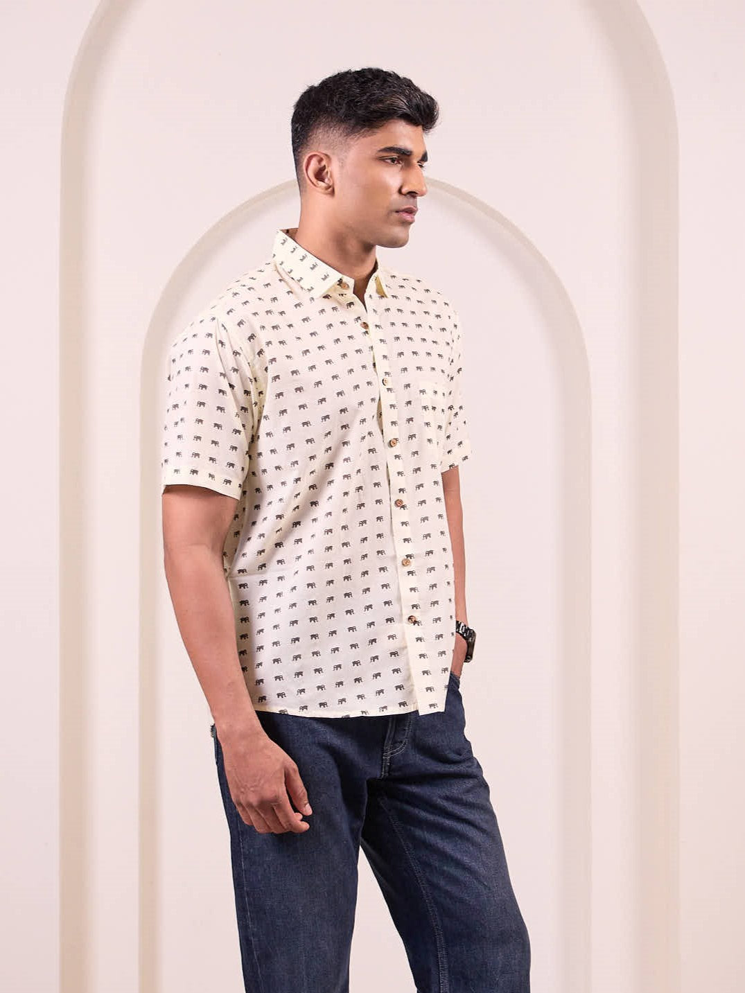 Side profile of man in earthy animal print cotton shirt