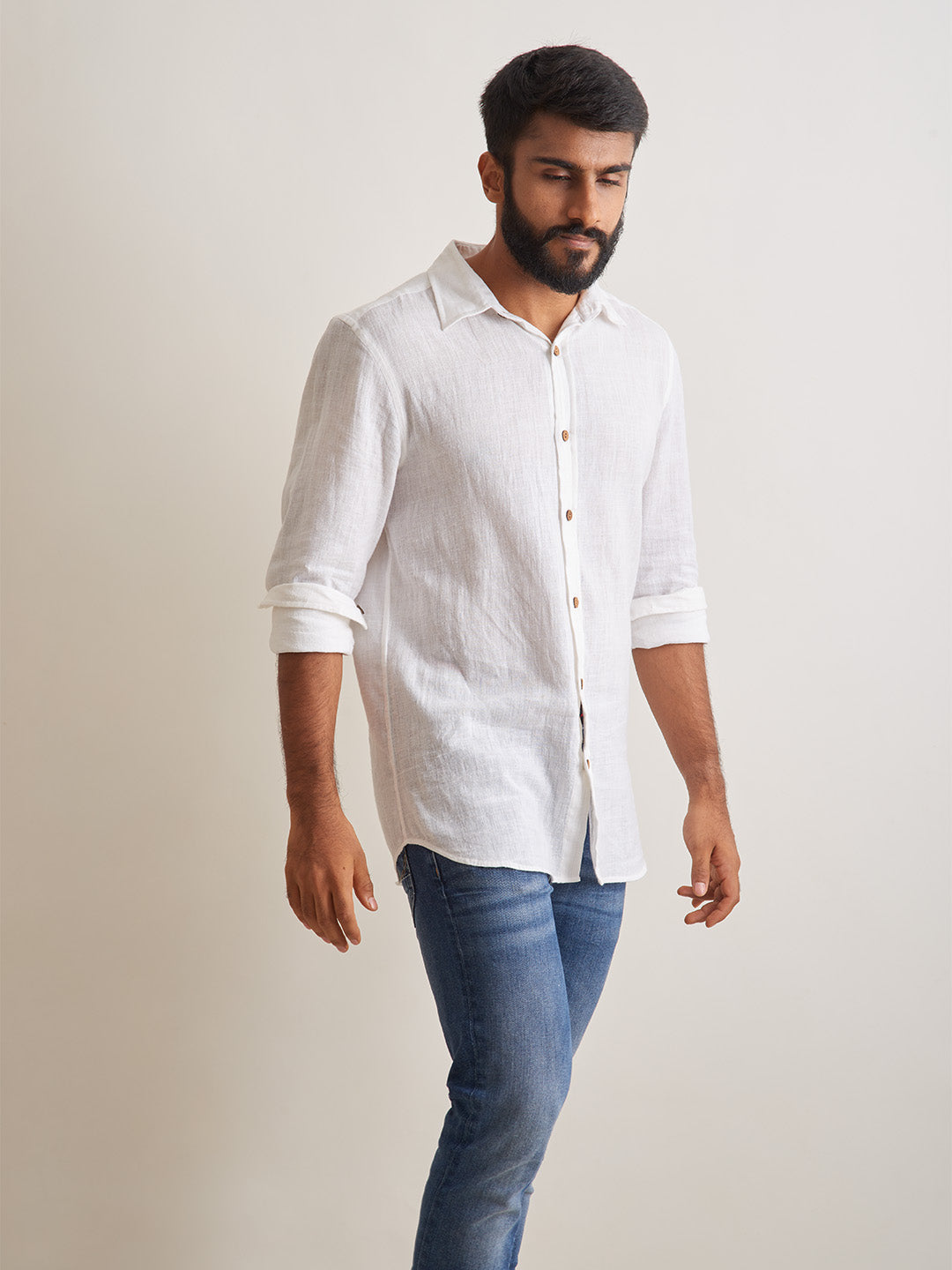 Model Facing sideways wearing Morning mist linen shirt by Brand Patrah