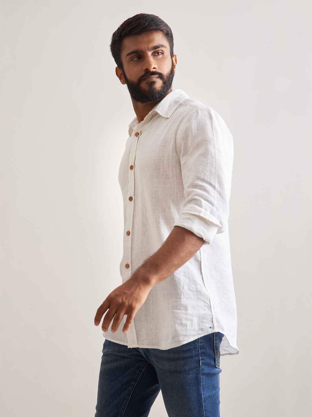 Model Facing sideways wearing Morning mist linen shirt by Brand Patrah