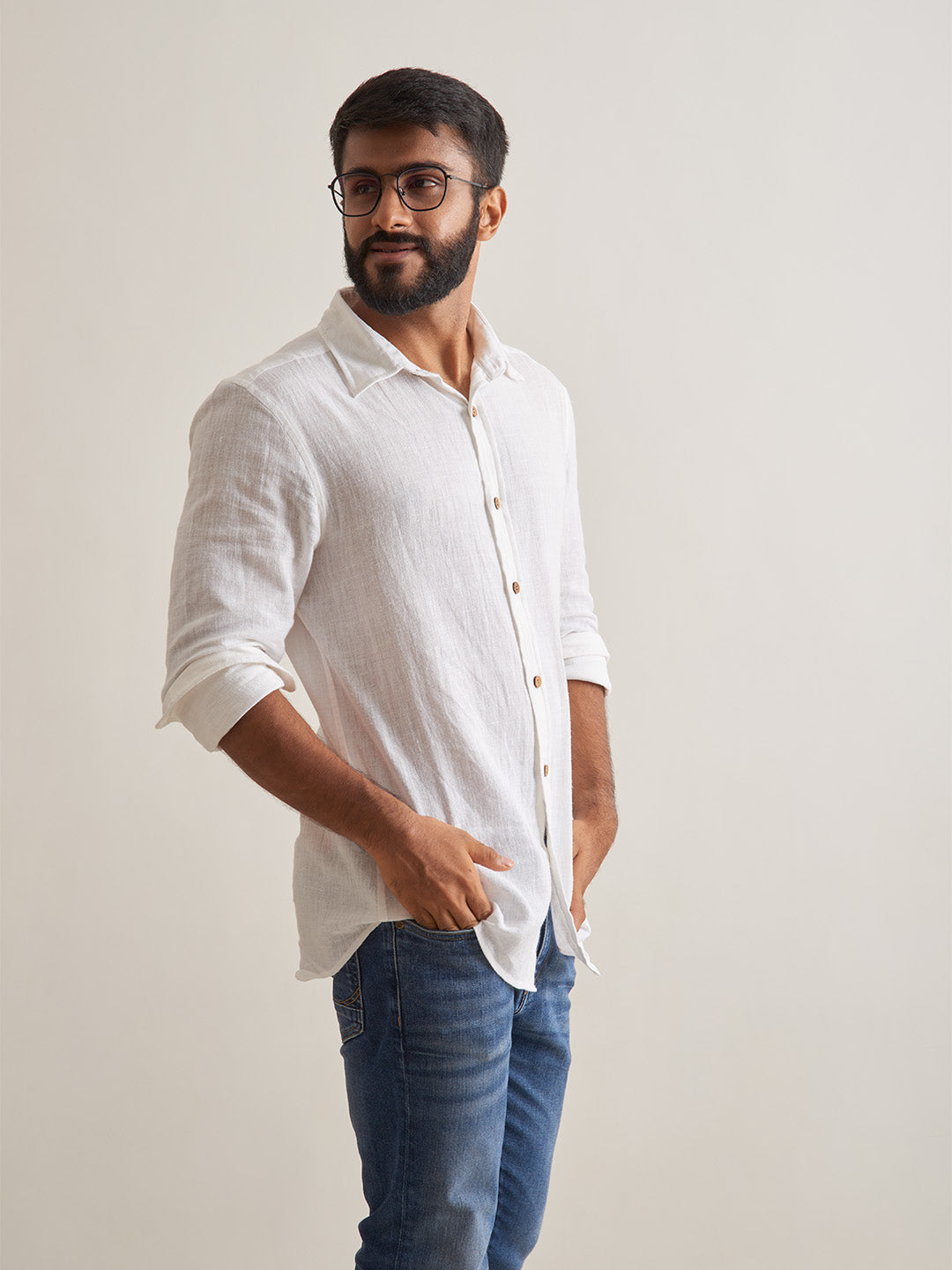 Model Facing sideways wearing Morning mist linen shirt by Brand Patrah