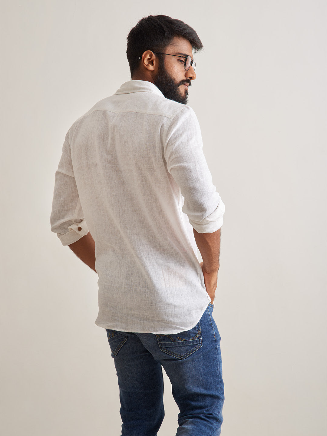 Model facing backwards wearing Morning mist linen shirt by Brand Patrah