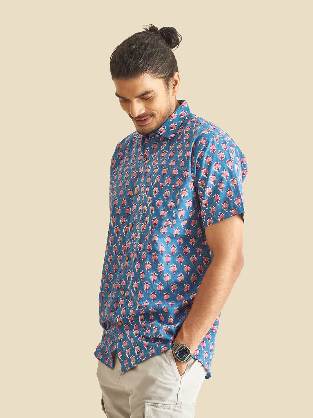 Model Facing sideways wearing Blue Floral Block Printed Halfsleeves Cotton Shirt by Brand Patrah