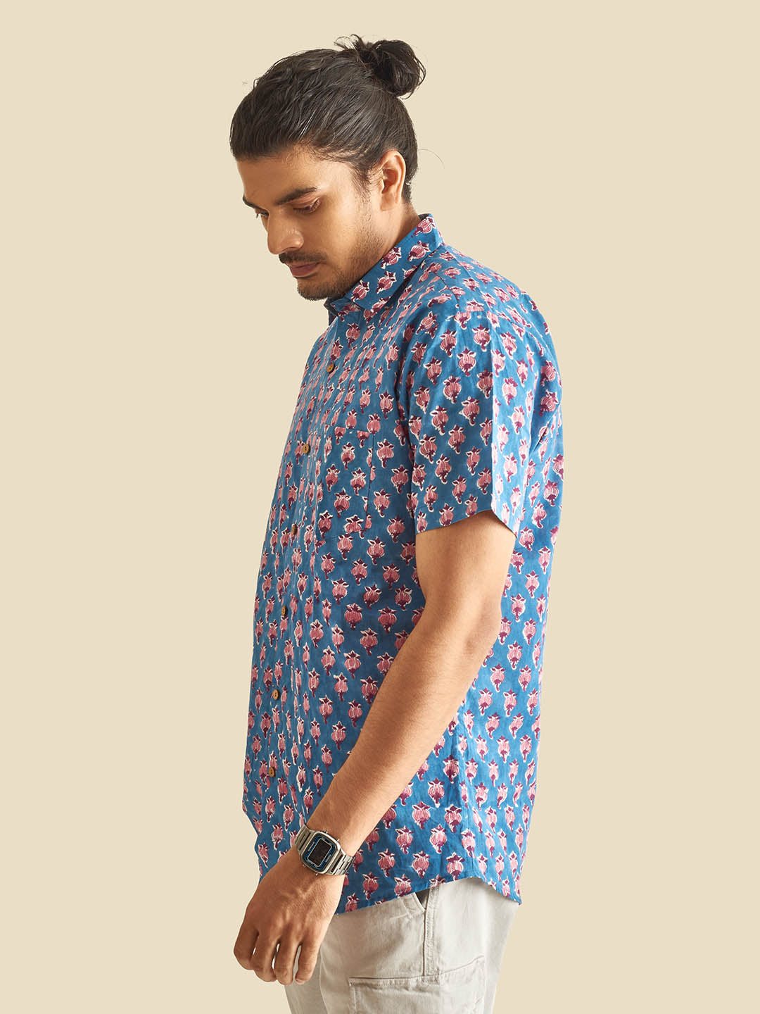 Model Facing sideways wearing Blue Floral Block Printed Halfsleeves Cotton Shirt by Brand Patrah